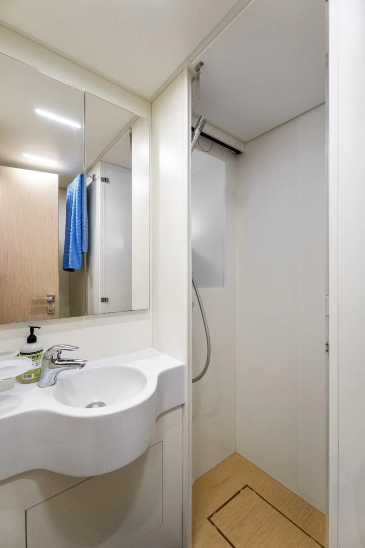a bathroom with a sink and a mirror aboard PINCH ME Yacht for Sale