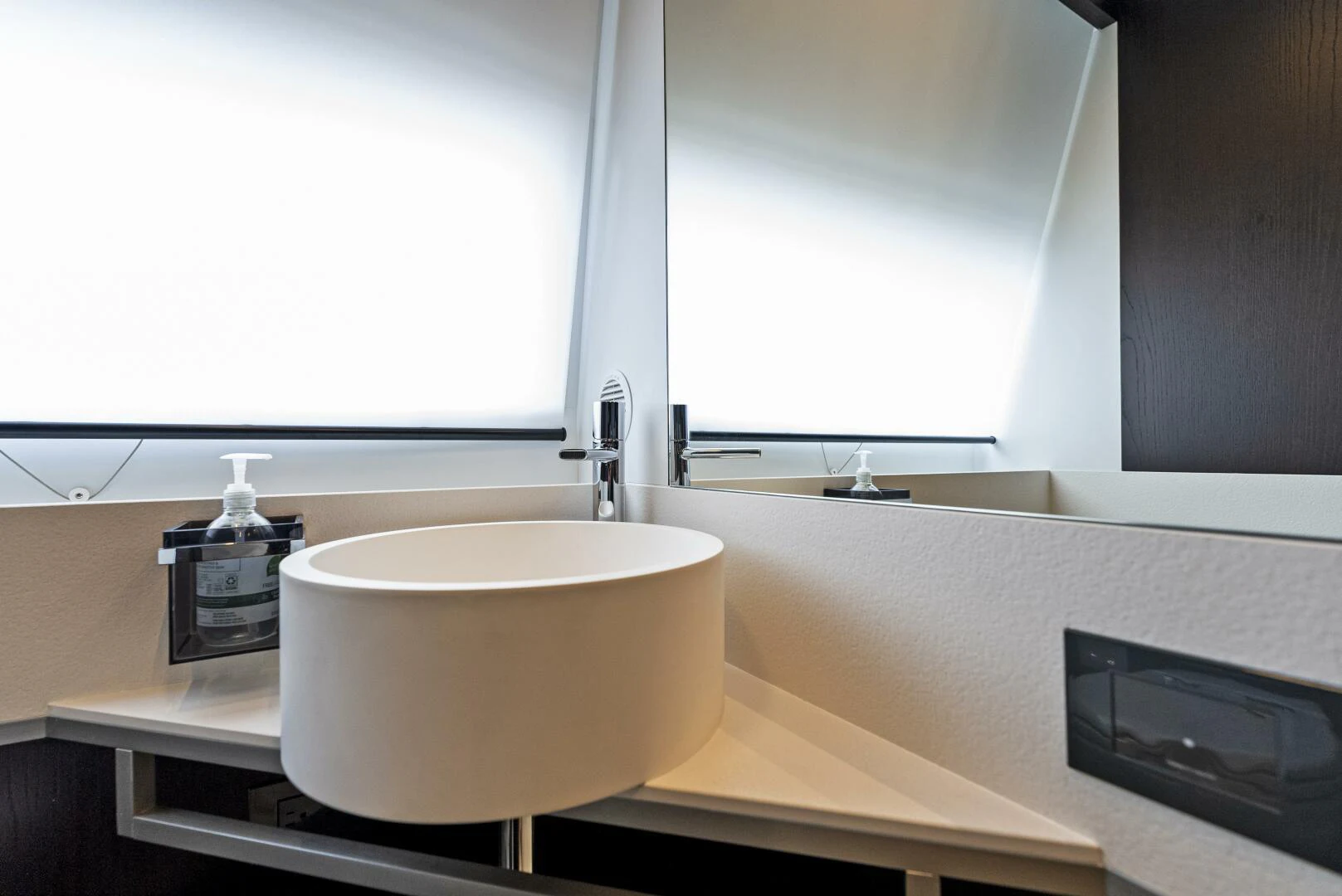 a bathroom with a large window aboard PINCH ME Yacht for Sale