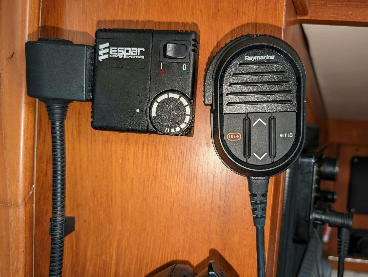 a group of black speakers on a wooden surface aboard MOJO Yacht for Sale