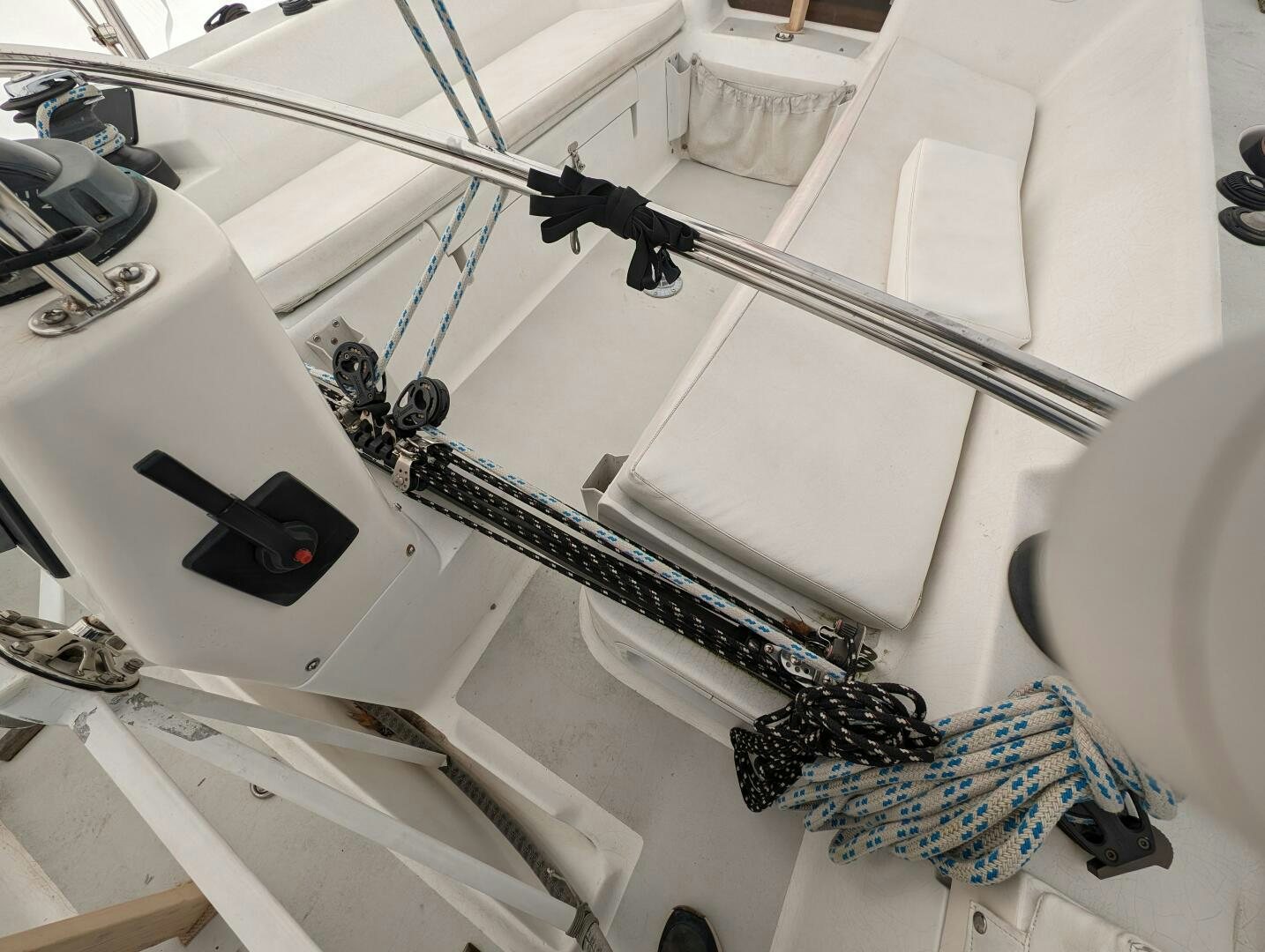 a group of people working on a white machine aboard MOJO Yacht for Sale