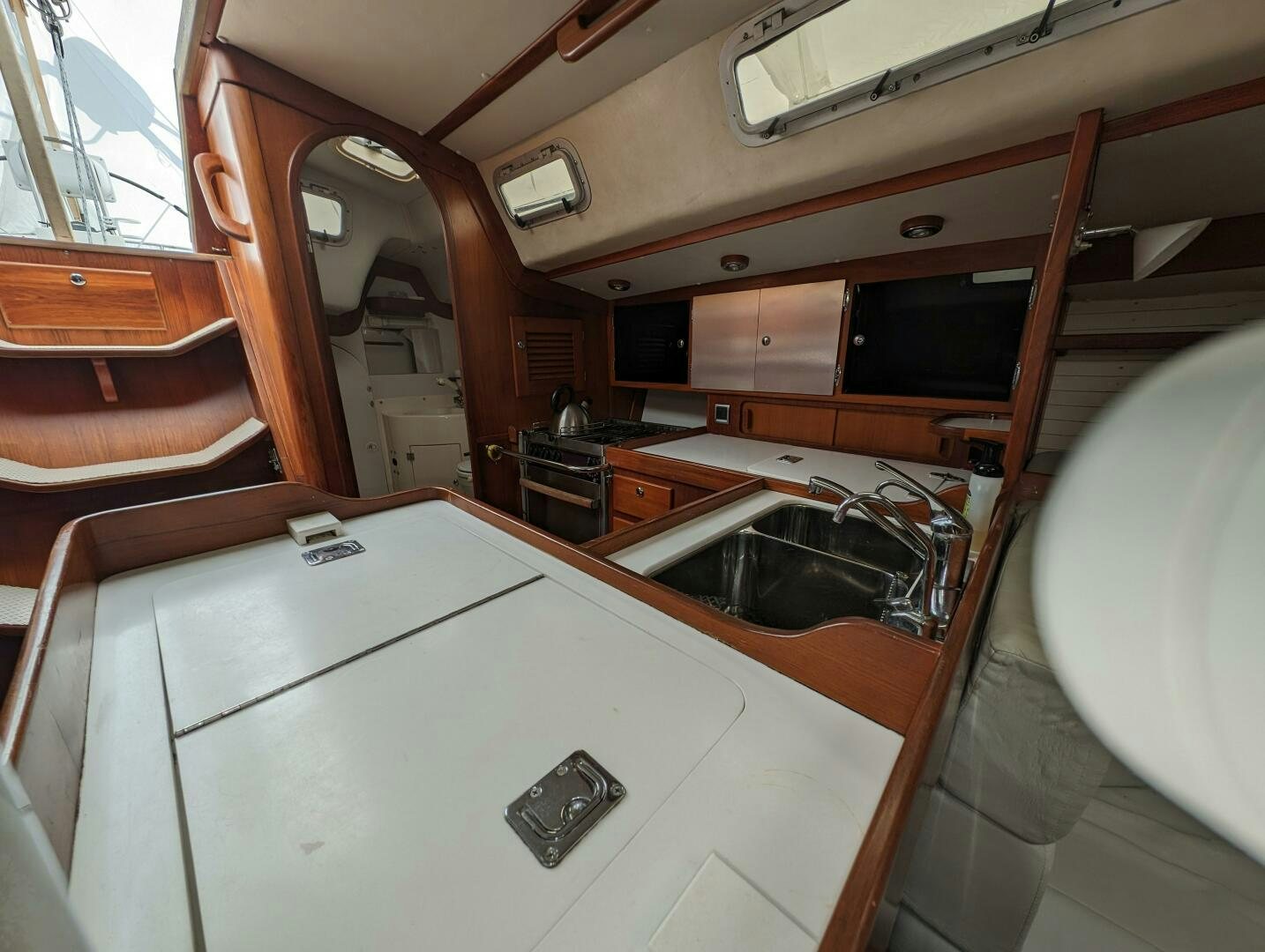 a bathroom with a sink and a mirror aboard MOJO Yacht for Sale