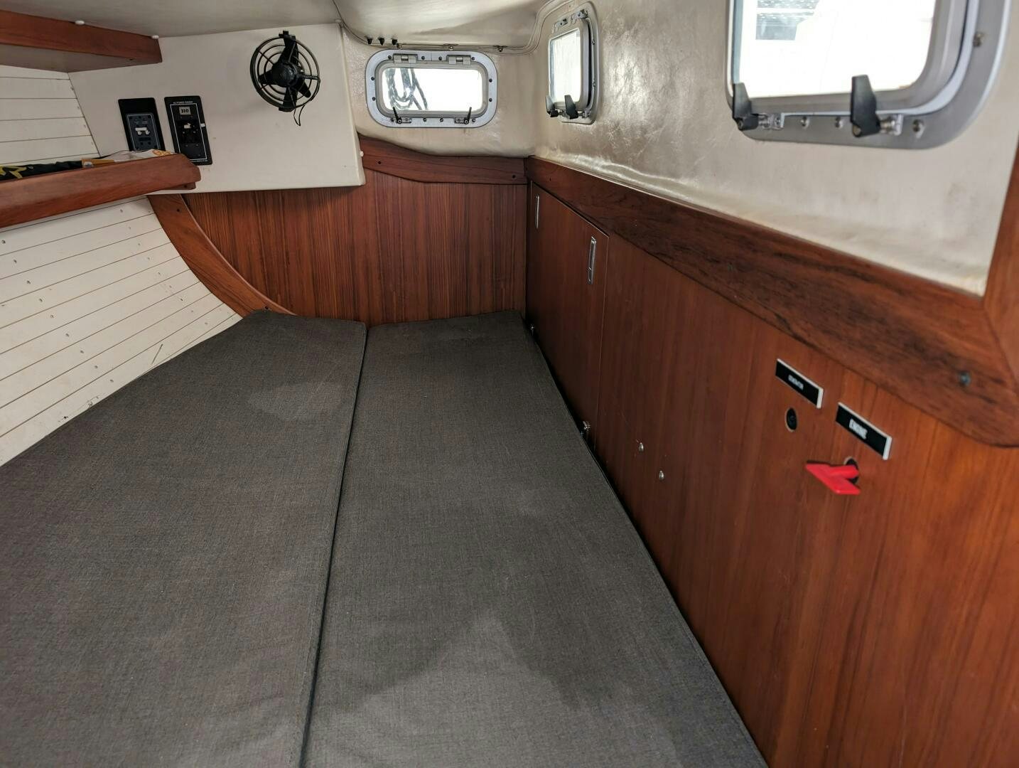 a room with wooden cabinets aboard MOJO Yacht for Sale