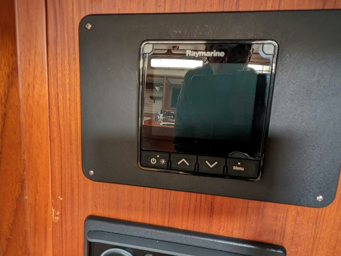a black rectangular electronic device aboard MOJO Yacht for Sale