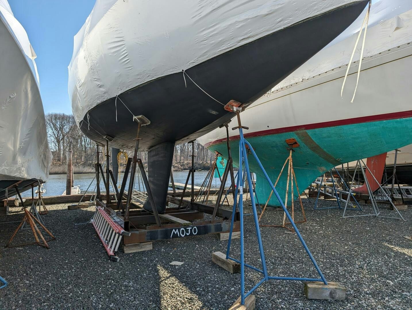 a person standing under a tent aboard MOJO Yacht for Sale