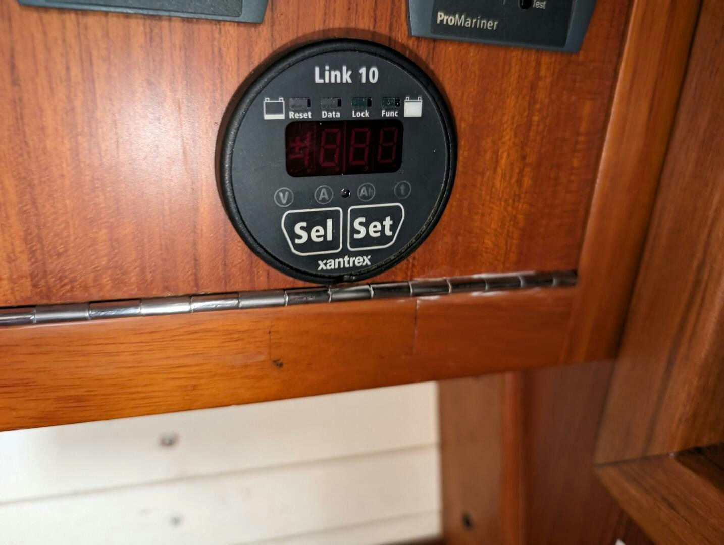 a black meter on a wooden wall aboard MOJO Yacht for Sale