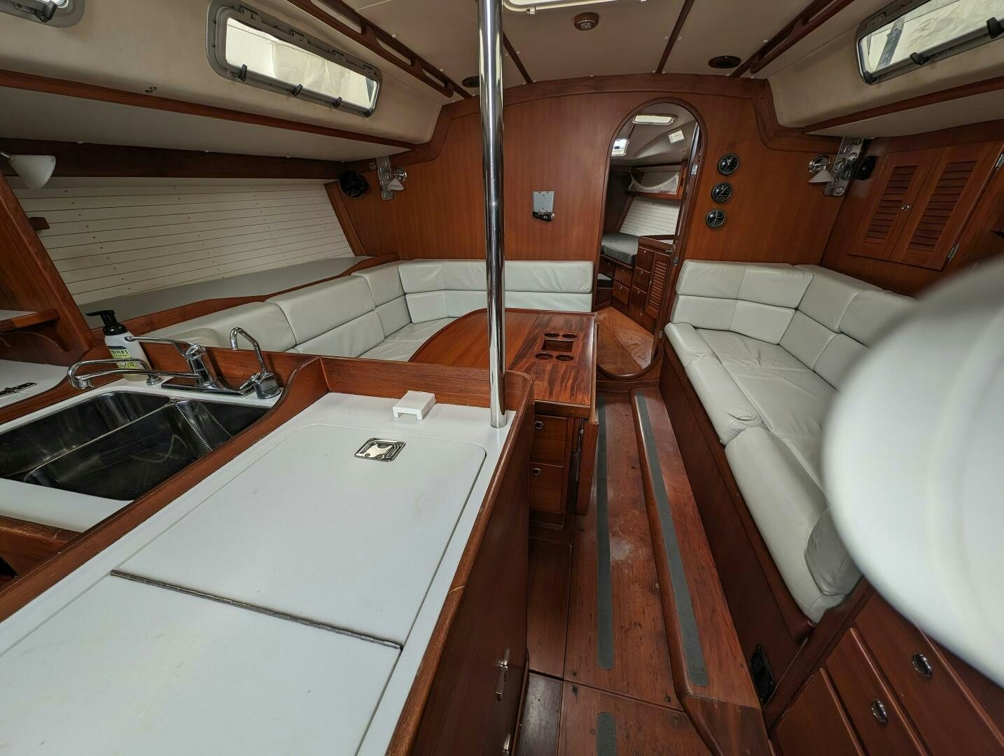 a bathroom with a tub sink and a sink aboard MOJO Yacht for Sale