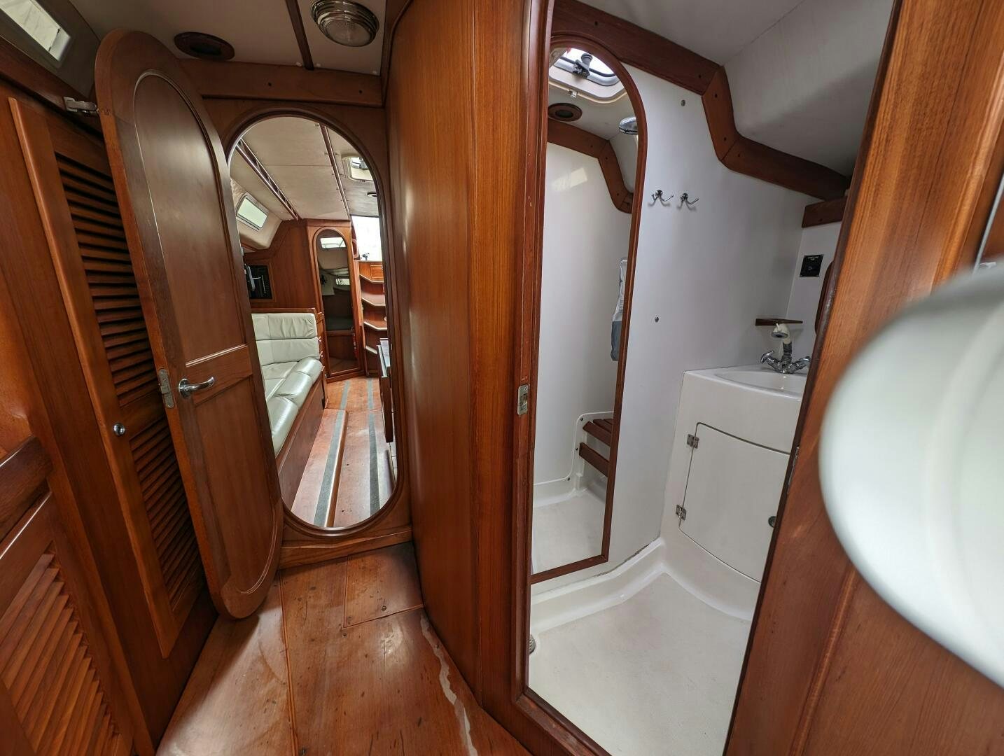 a bathroom with a large mirror aboard MOJO Yacht for Sale