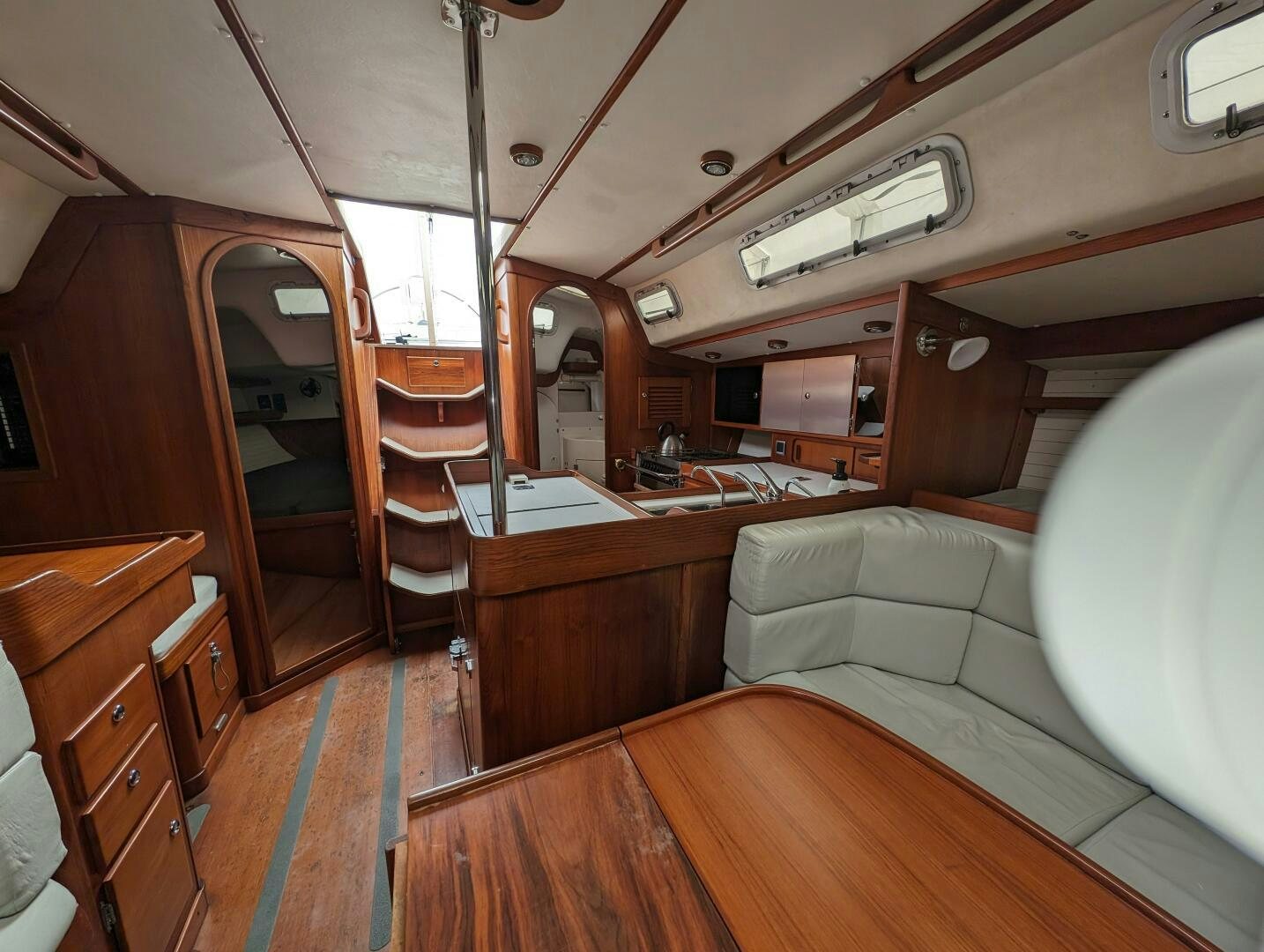a room with a couch and a table aboard MOJO Yacht for Sale