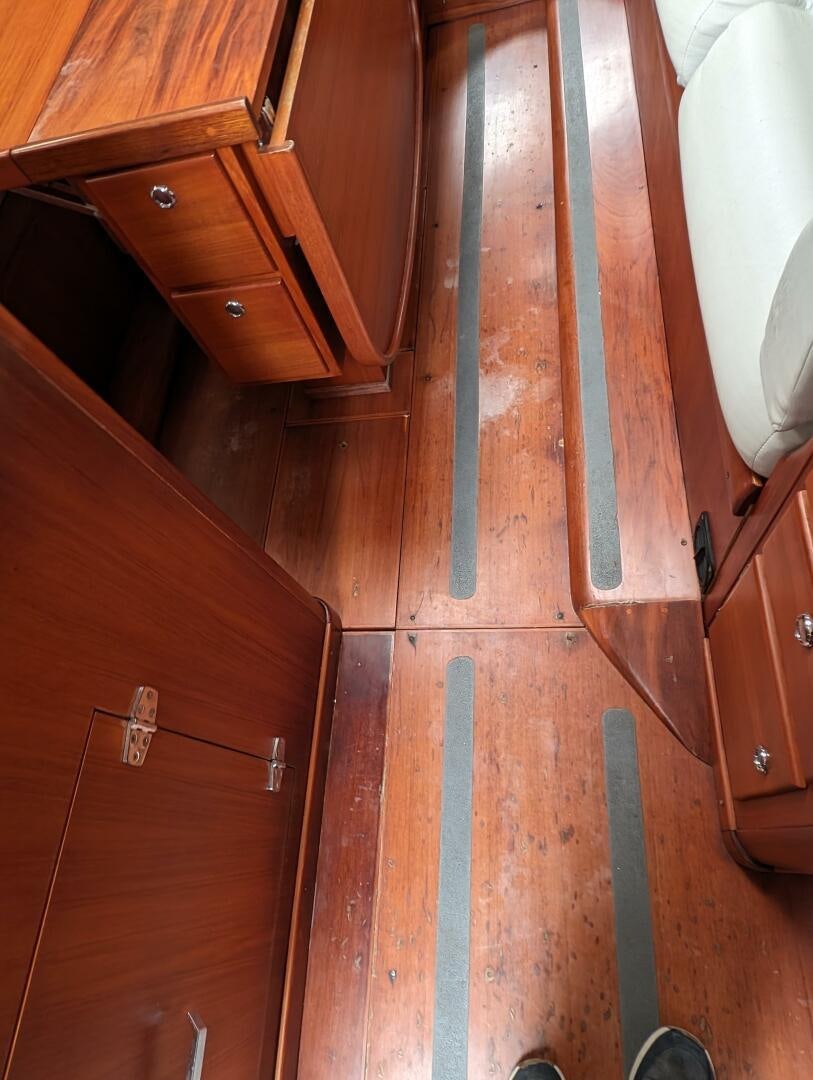 a wooden cabinet with drawers aboard MOJO Yacht for Sale