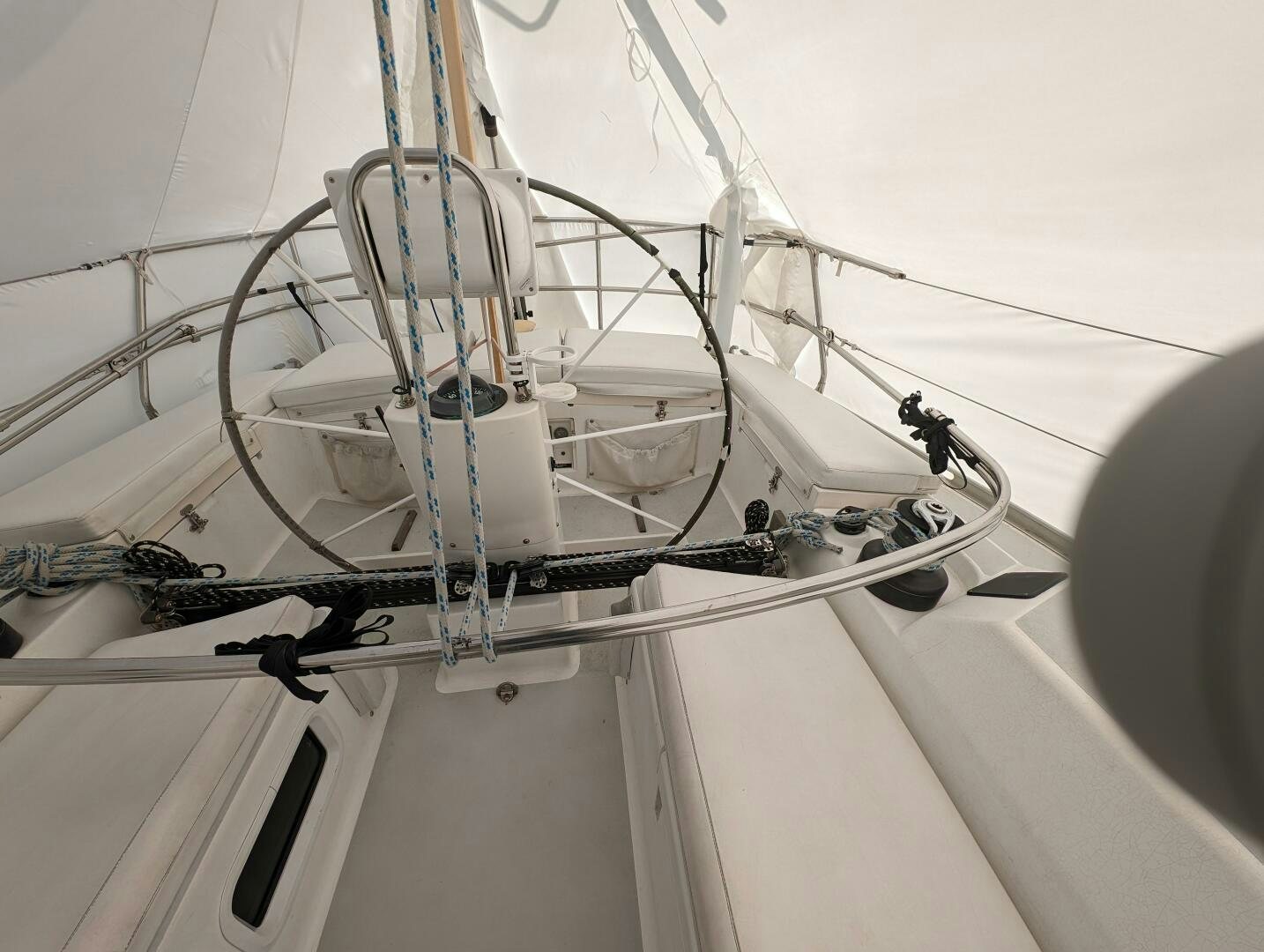 a white boat with a metal frame aboard MOJO Yacht for Sale