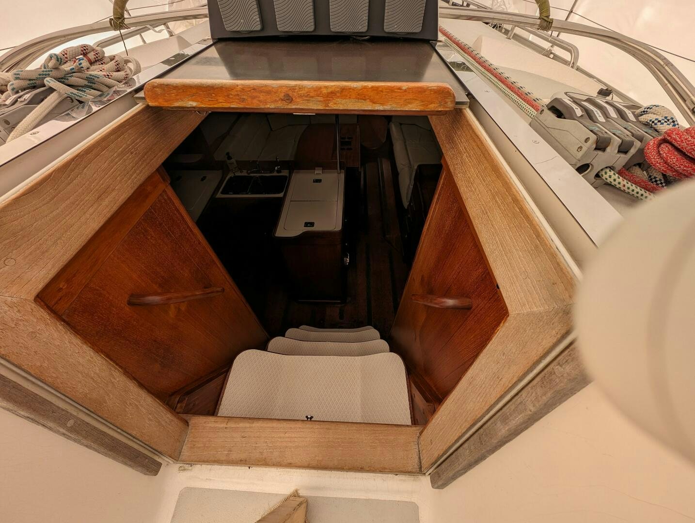 a wooden cabinet with drawers aboard MOJO Yacht for Sale