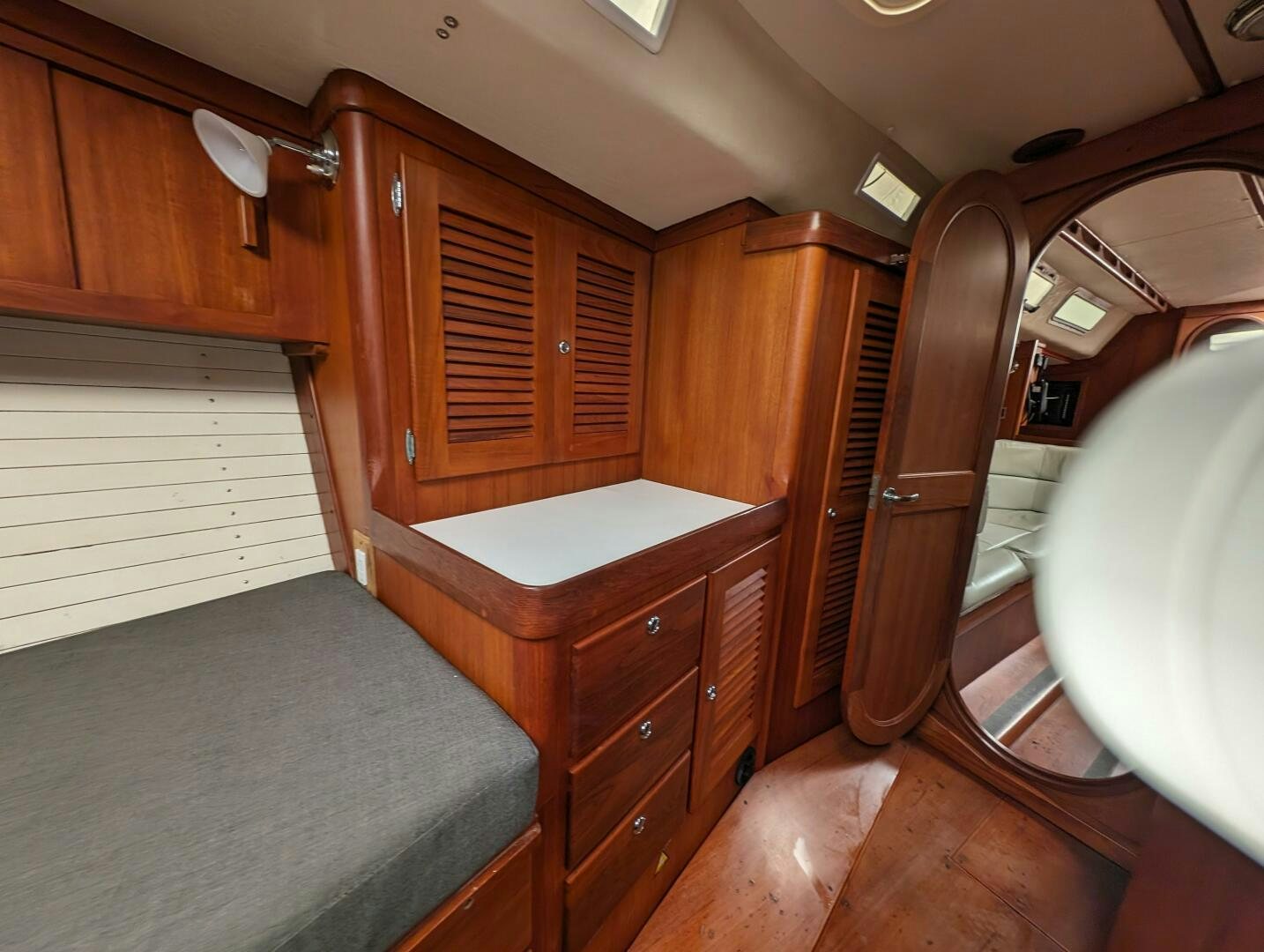 a room with wooden cabinets aboard MOJO Yacht for Sale