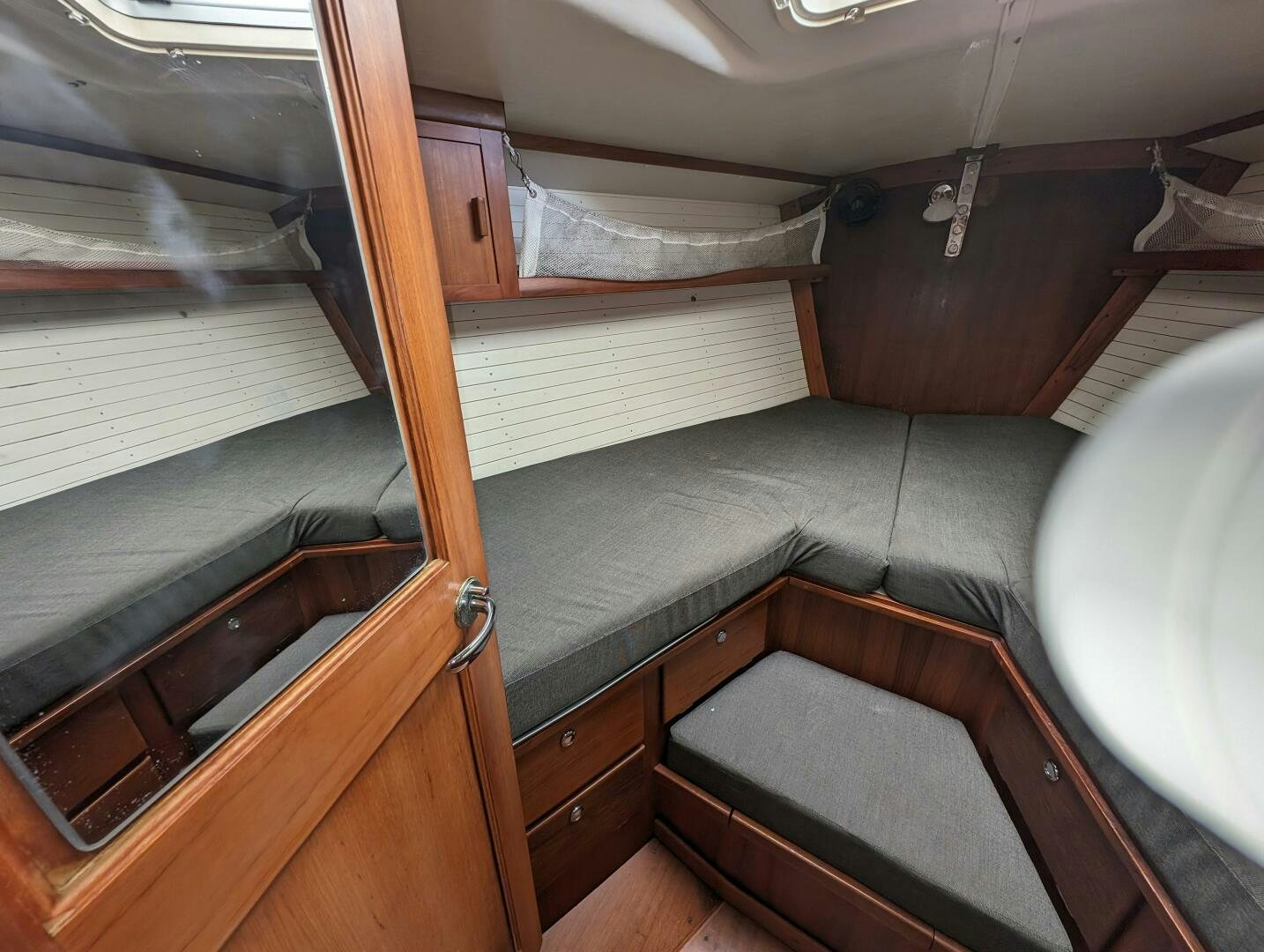 a room with a bed and a window aboard MOJO Yacht for Sale