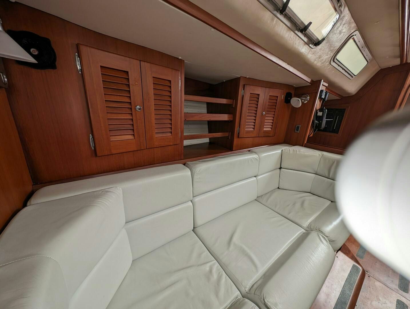 a couch in a room aboard MOJO Yacht for Sale