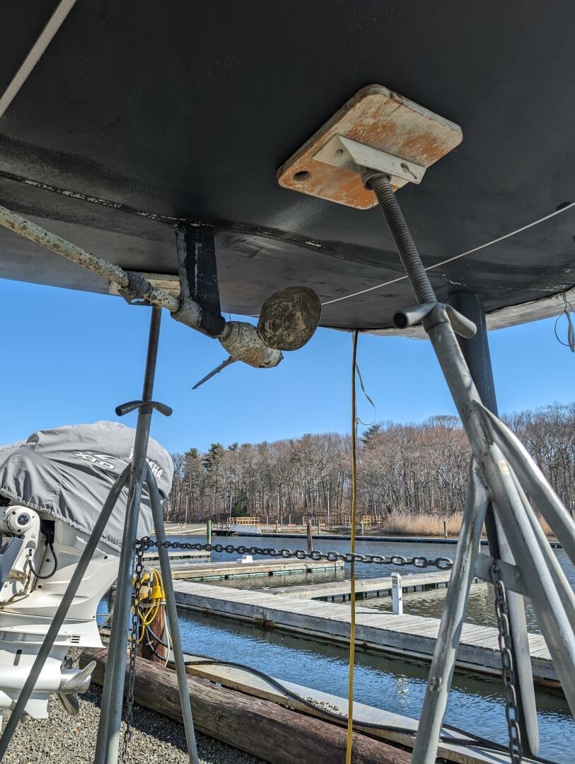 a wooden structure with a round object on it aboard MOJO Yacht for Sale