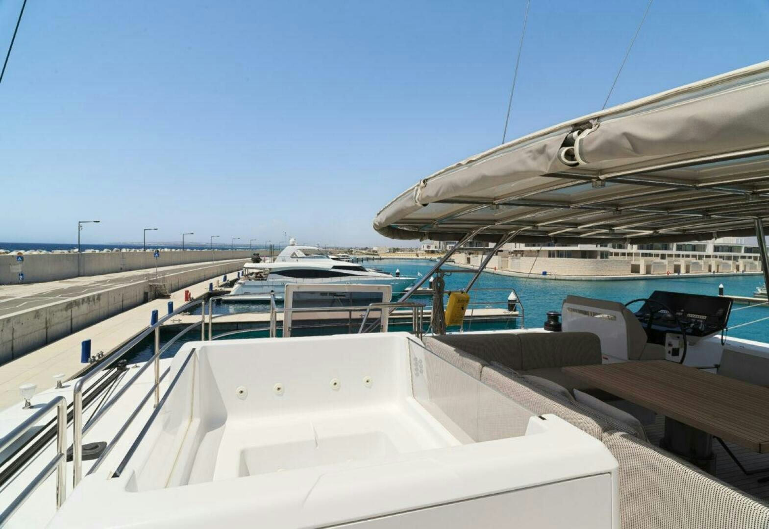 a large metal structure with a metal roof and a metal roof aboard OV Yacht for Sale