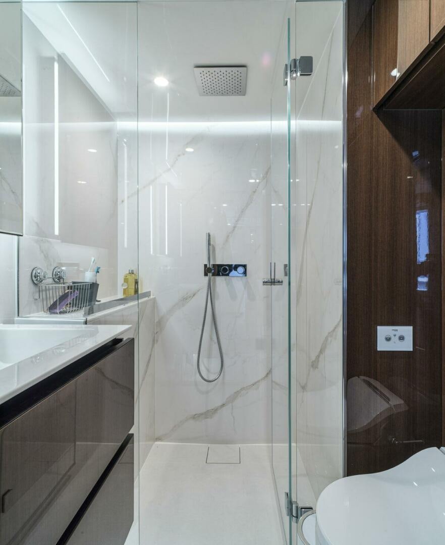 a shower with a glass door aboard OV Yacht for Sale