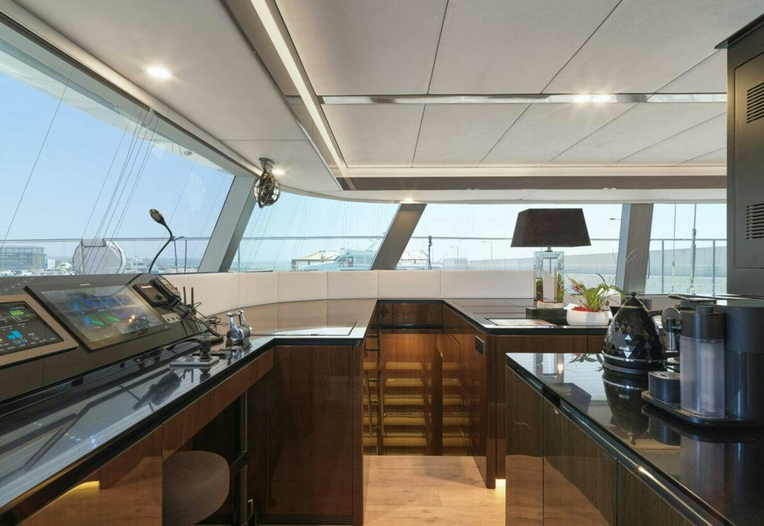 a kitchen with a large window aboard OV Yacht for Sale