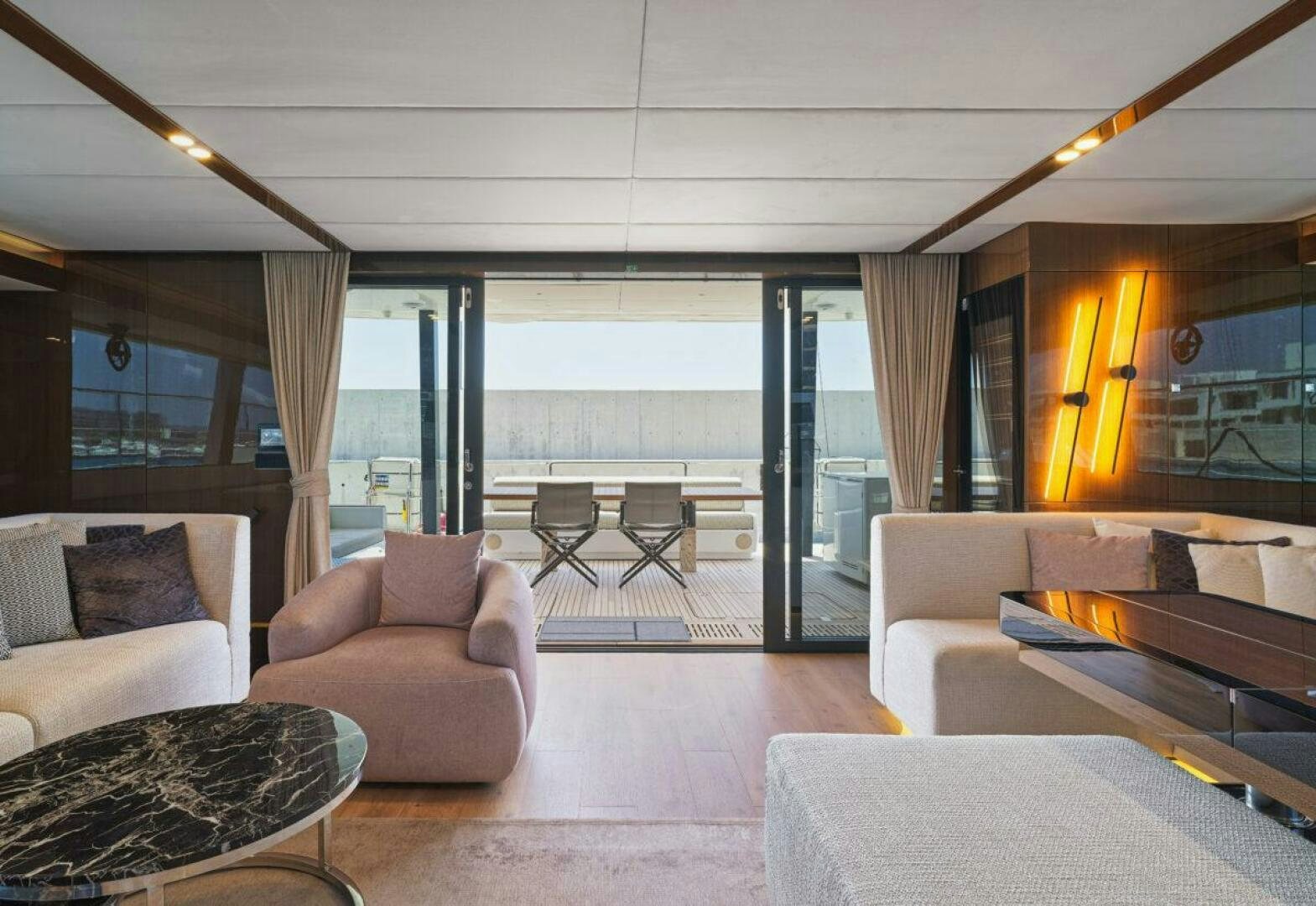 a living room with a large window aboard OV Yacht for Sale
