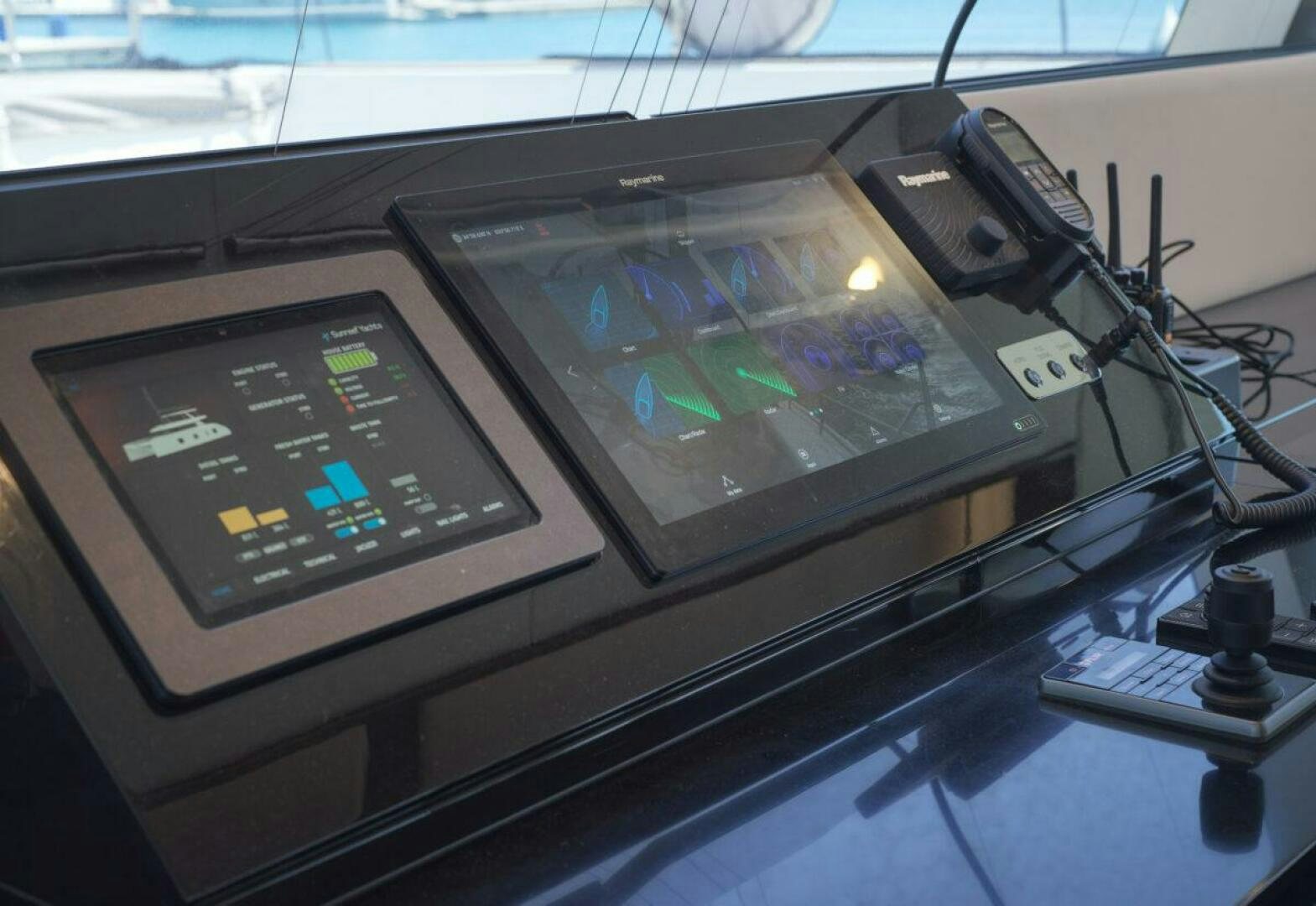 a gaming console and a remote control aboard OV Yacht for Sale