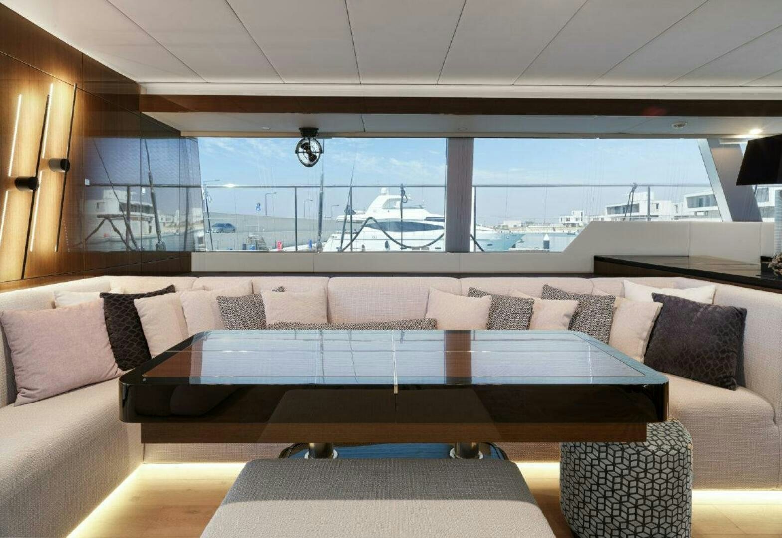 a couch with a view of the ocean aboard OV Yacht for Sale