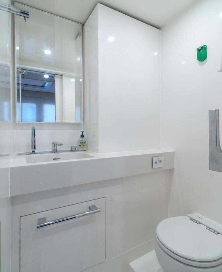 a bathroom with a sink and a toilet aboard OV Yacht for Sale
