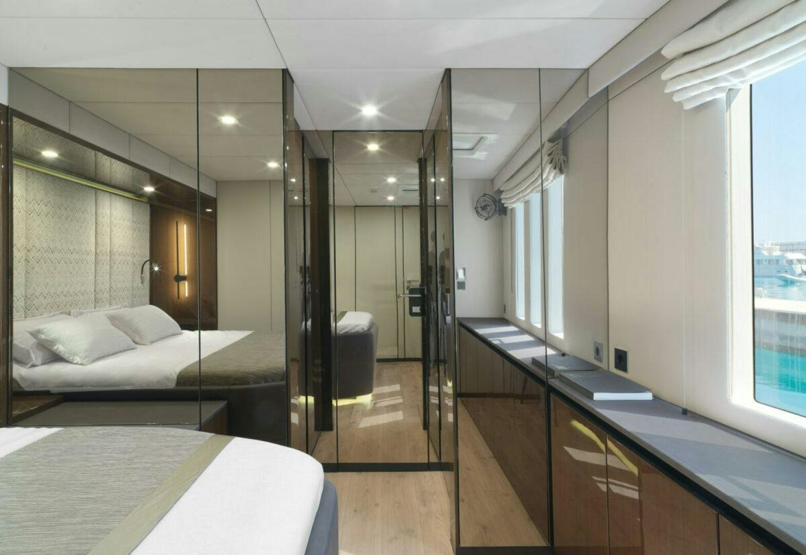 a bathroom with a large mirror aboard OV Yacht for Sale