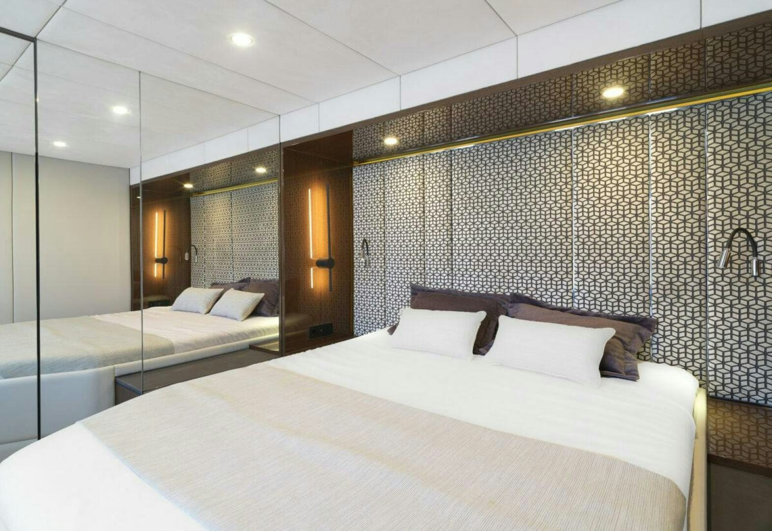 a room with two beds aboard OV Yacht for Sale