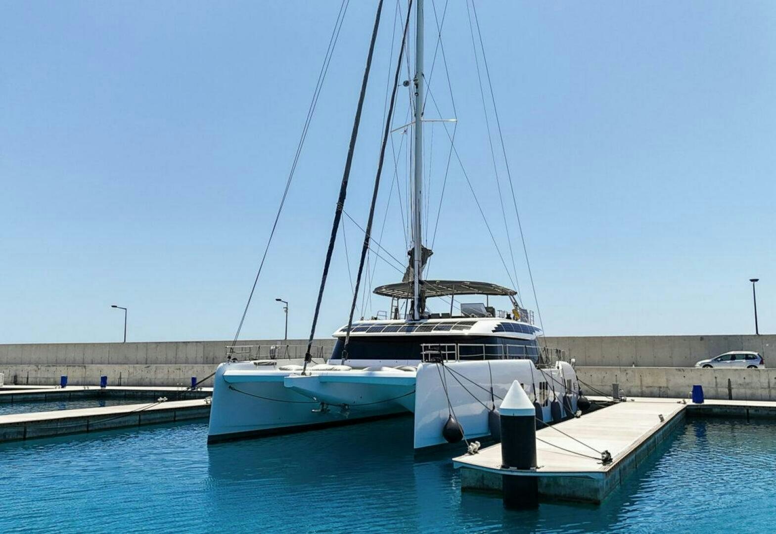a boat is parked on the dock aboard OV Yacht for Sale