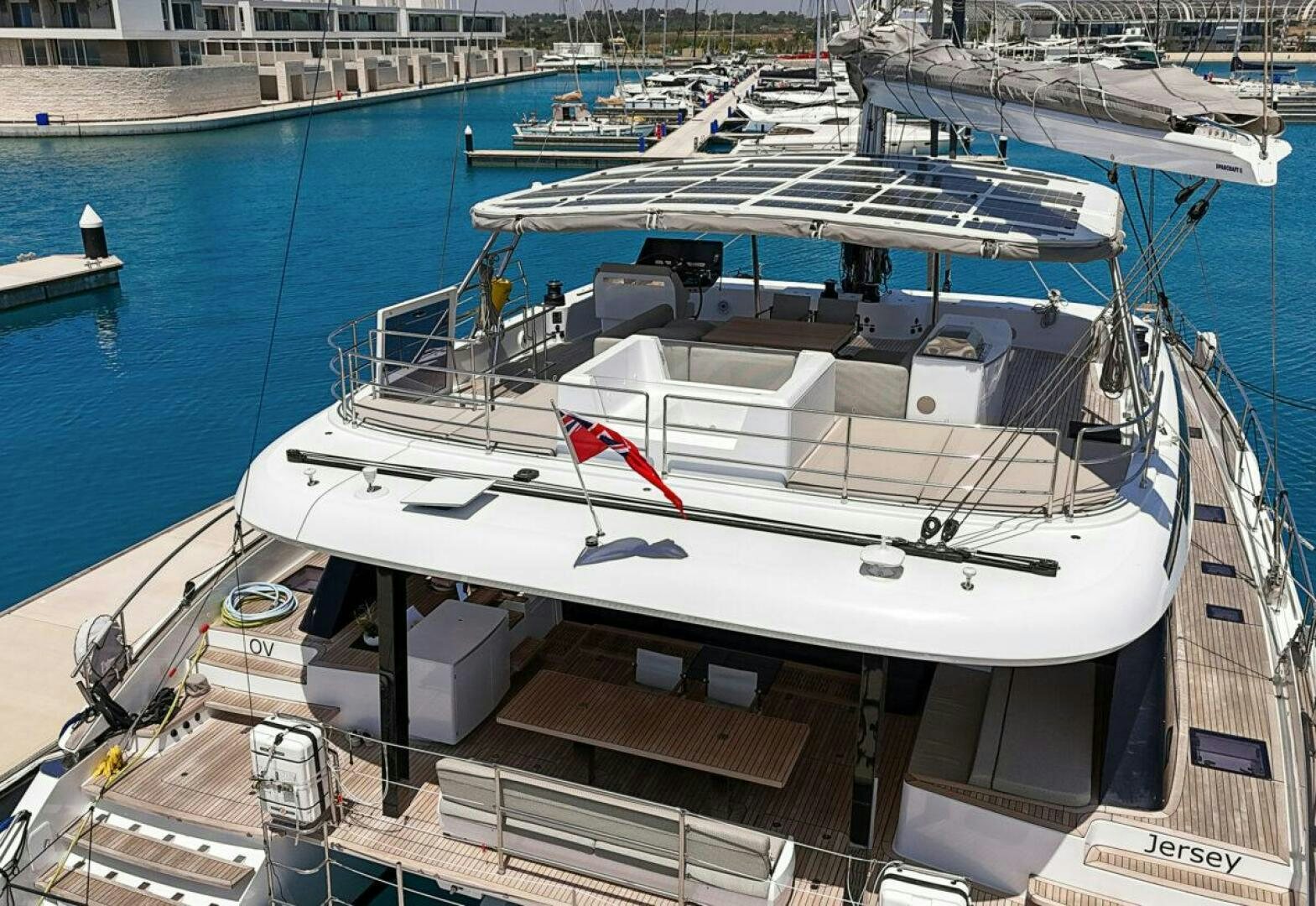 a boat docked at a pier aboard OV Yacht for Sale