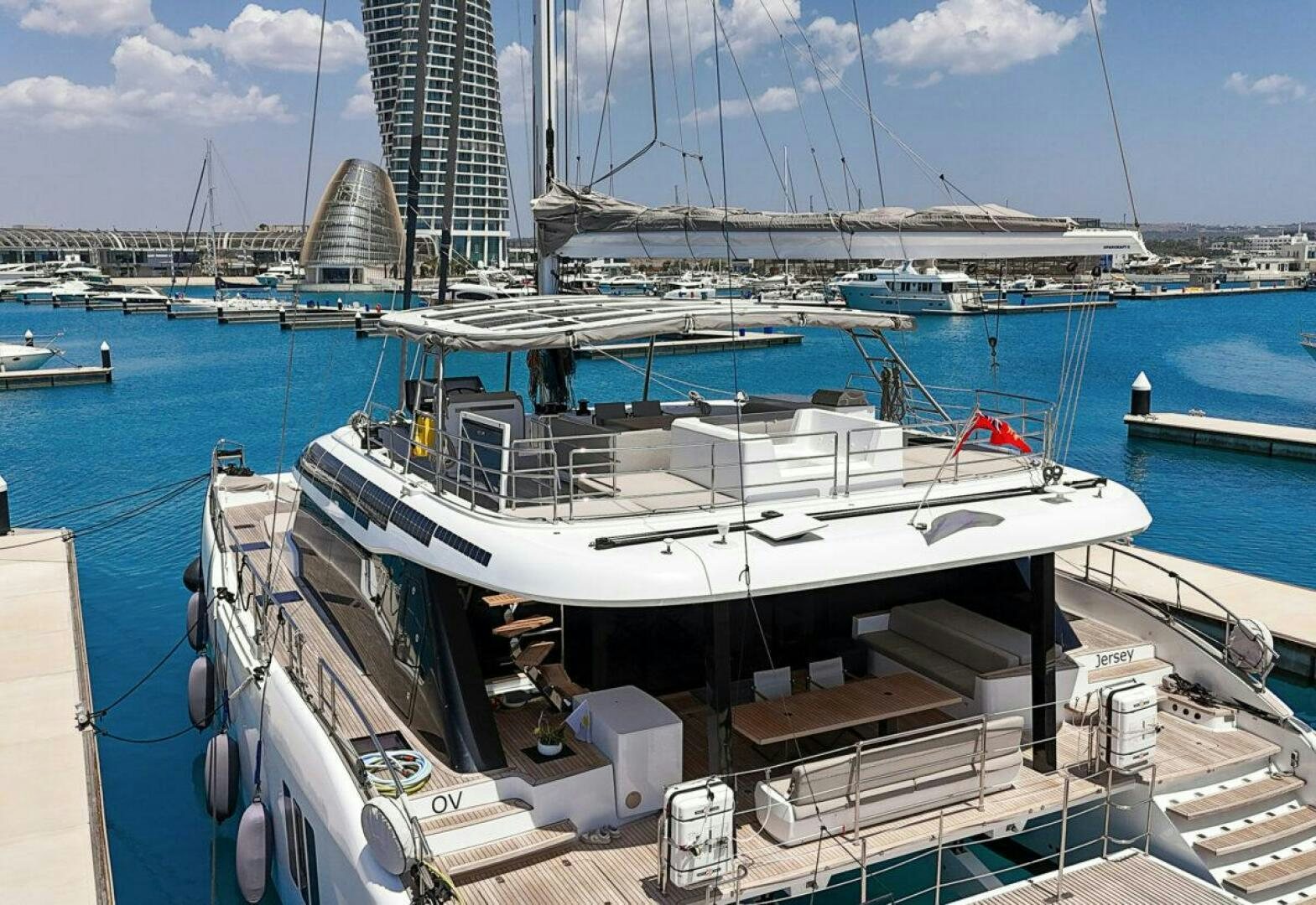 a boat docked at a pier aboard OV Yacht for Sale