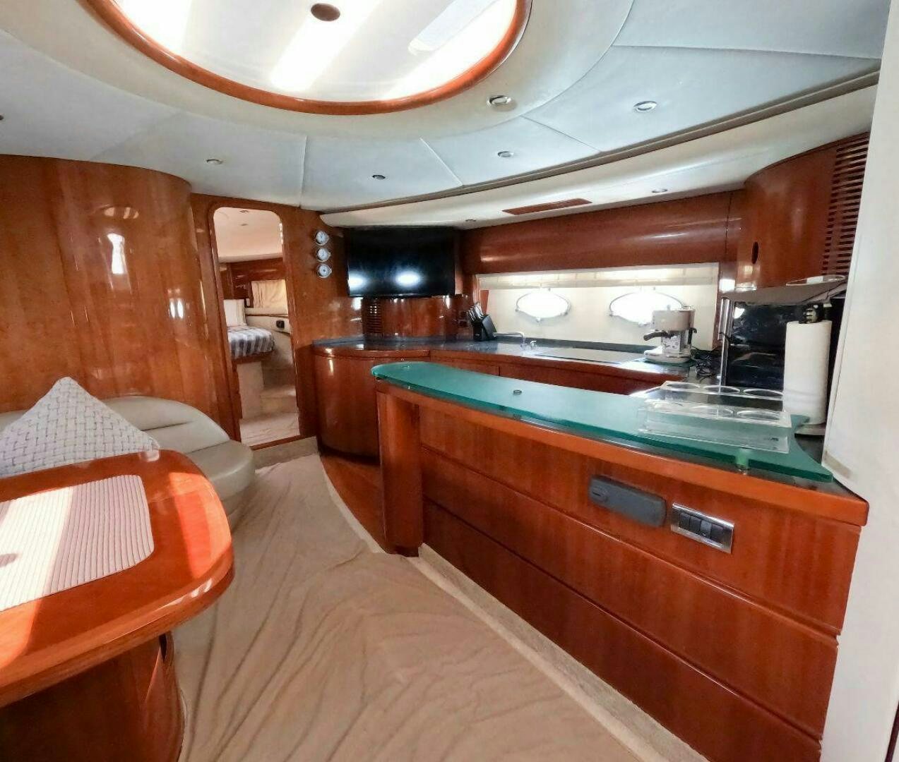 a kitchen with wooden cabinets aboard INCENTIVE Yacht for Sale