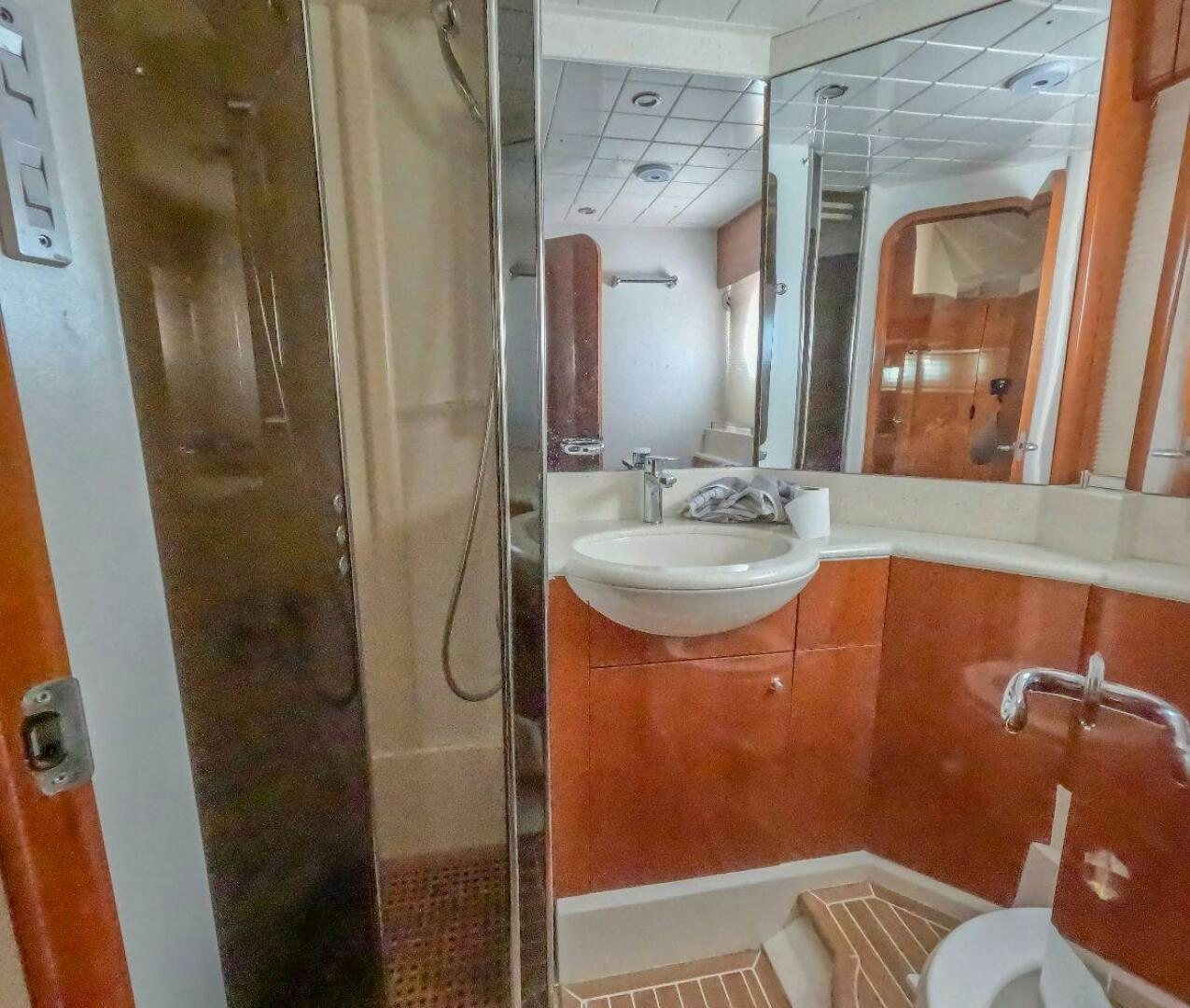 a bathroom with a sink and shower aboard INCENTIVE Yacht for Sale