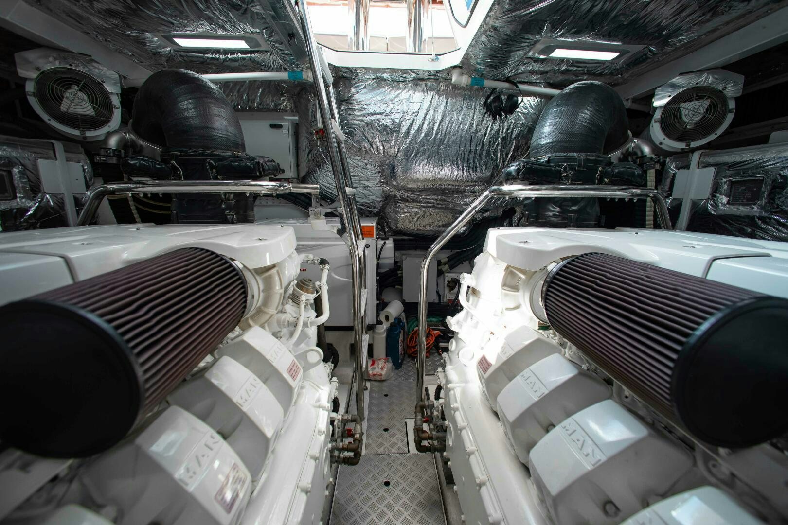 a car with a large engine aboard RIPPLE Yacht for Sale