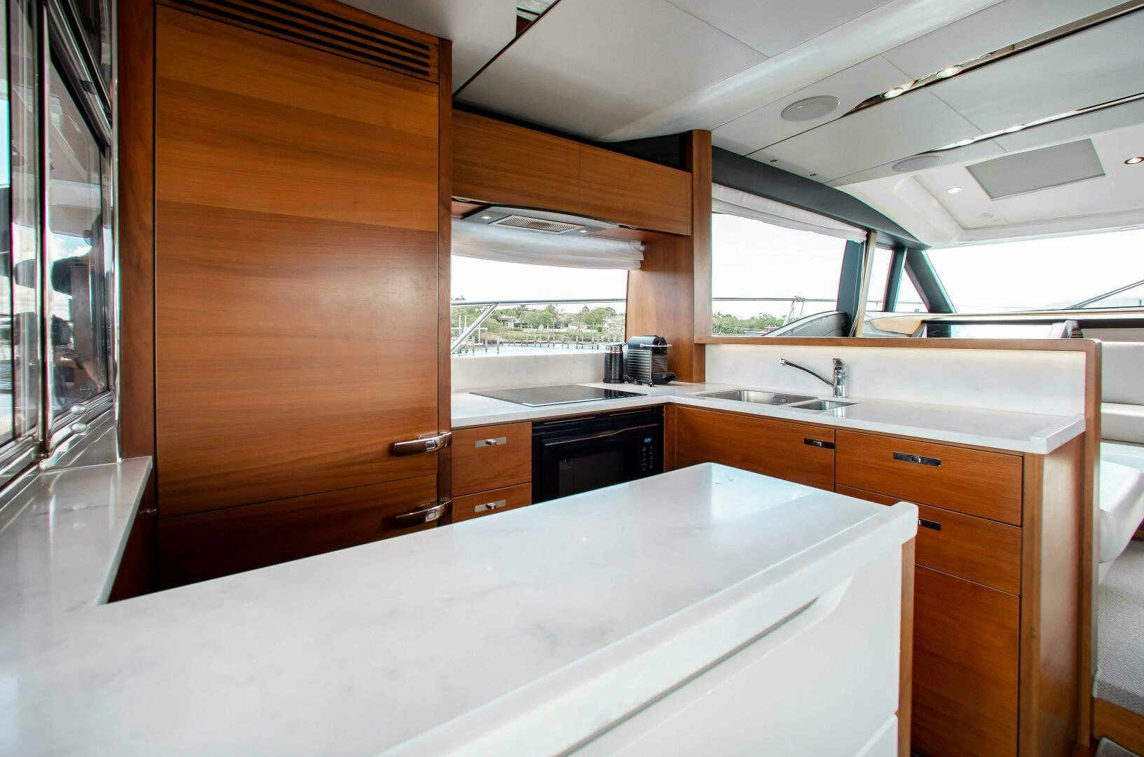 a kitchen with a large window aboard RIPPLE Yacht for Sale