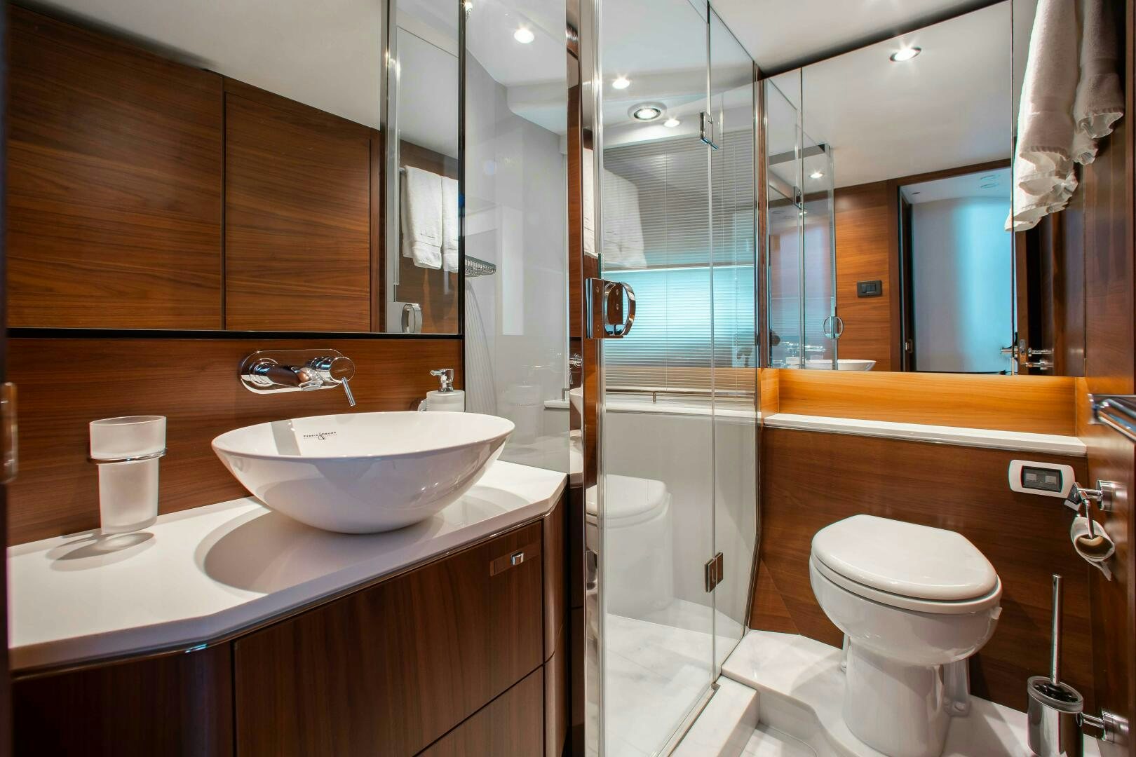 a bathroom with a glass shower aboard RIPPLE Yacht for Sale