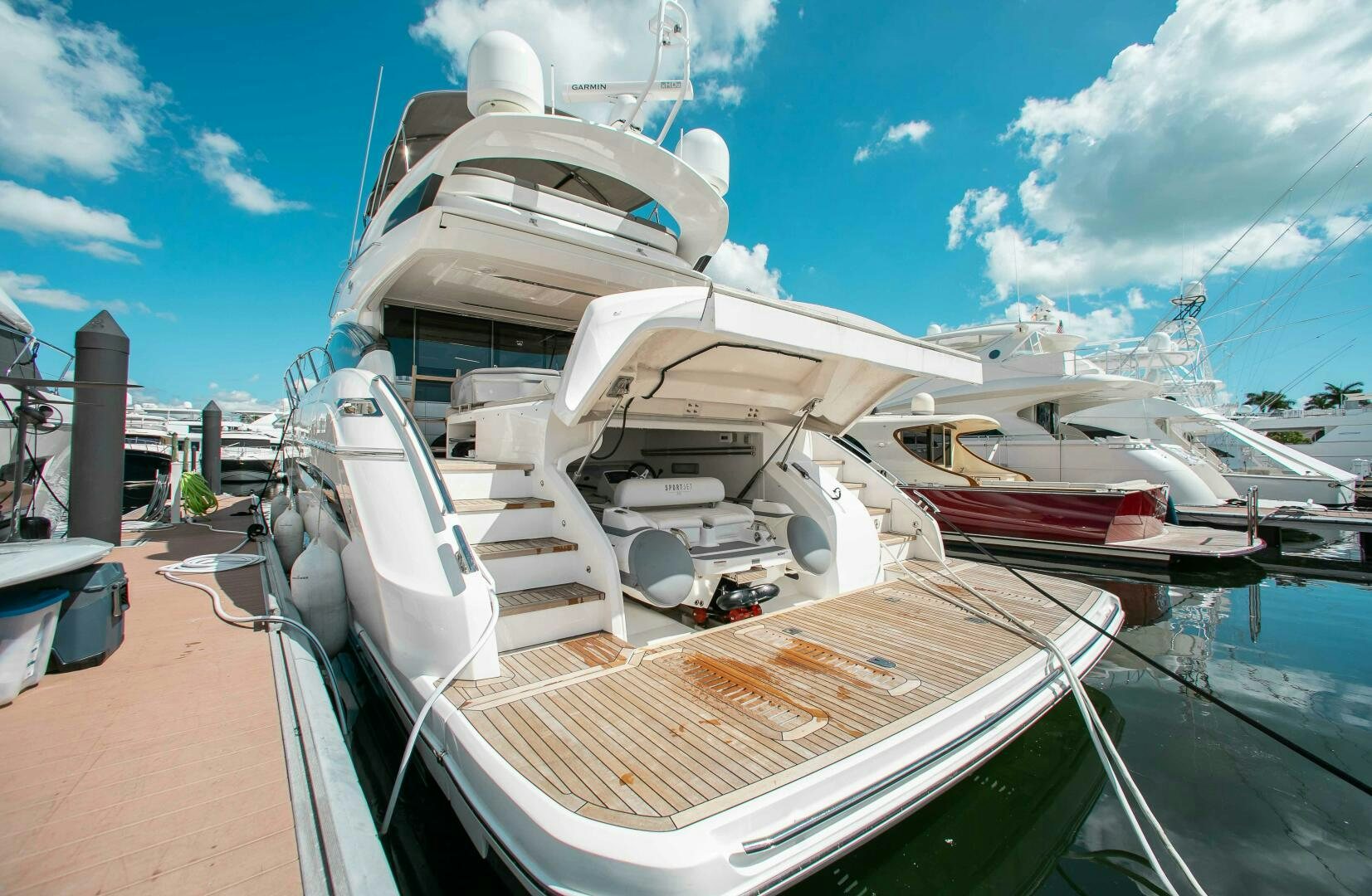 a large white boat docked aboard RIPPLE Yacht for Sale