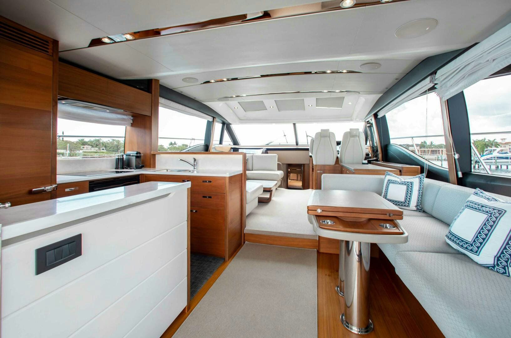 inside of a vehicle with a desk and chairs aboard RIPPLE Yacht for Sale