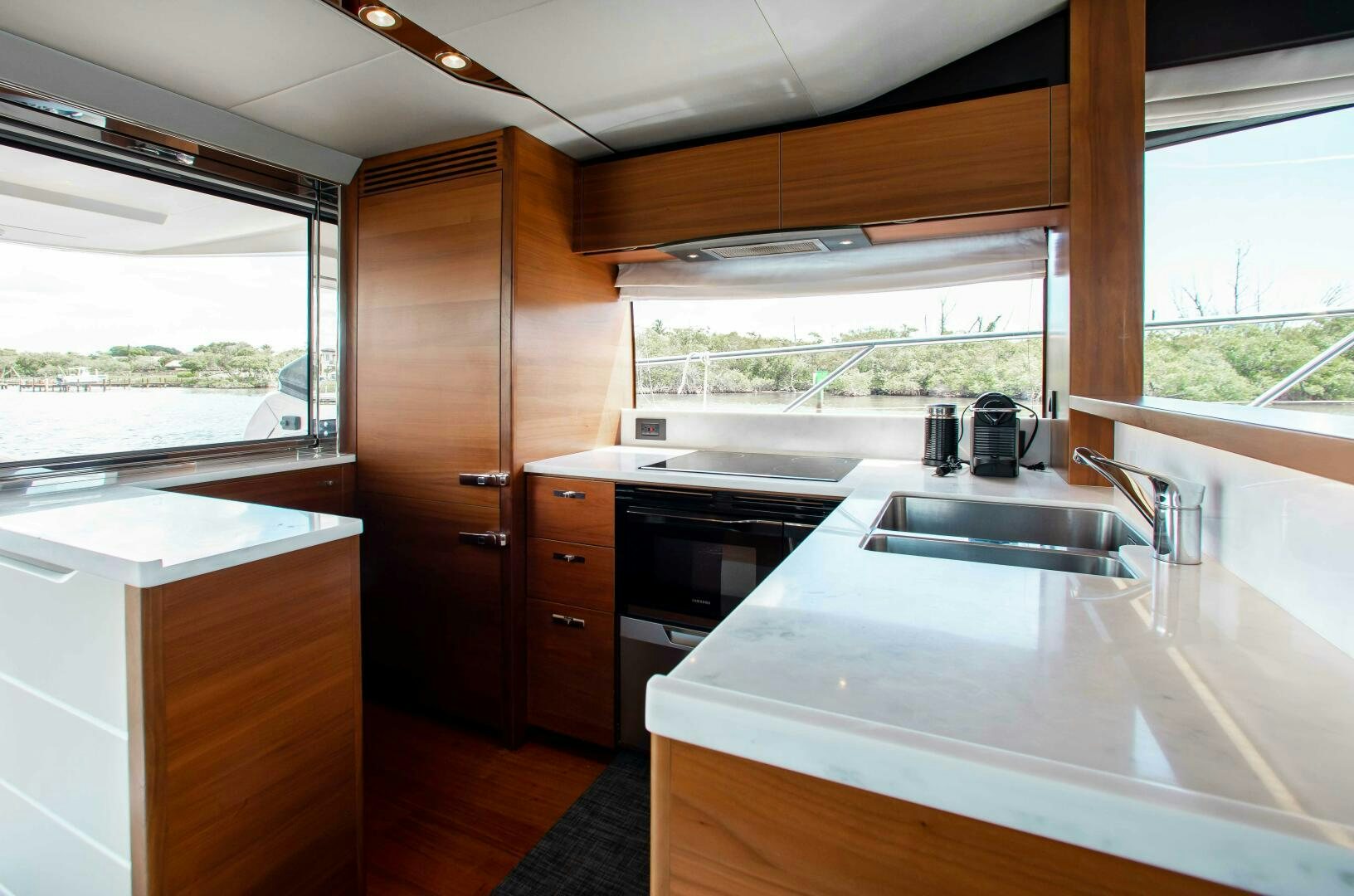 a kitchen with a sink and cabinets aboard RIPPLE Yacht for Sale