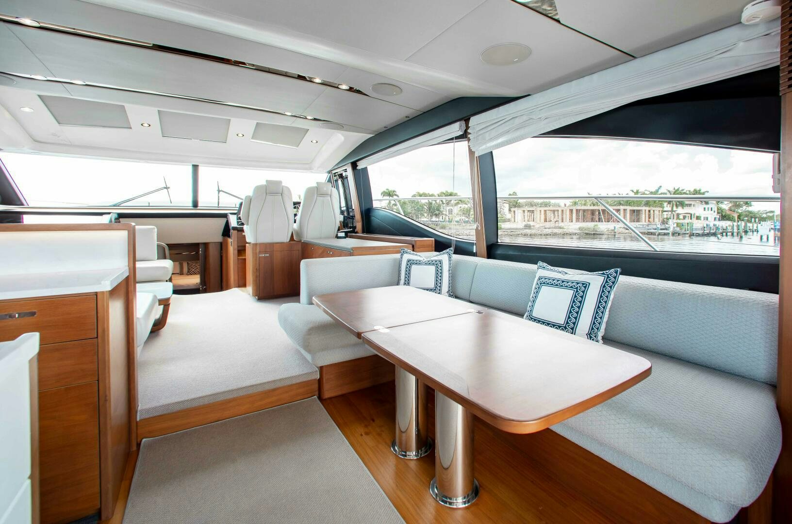 a room with a table and chairs aboard RIPPLE Yacht for Sale