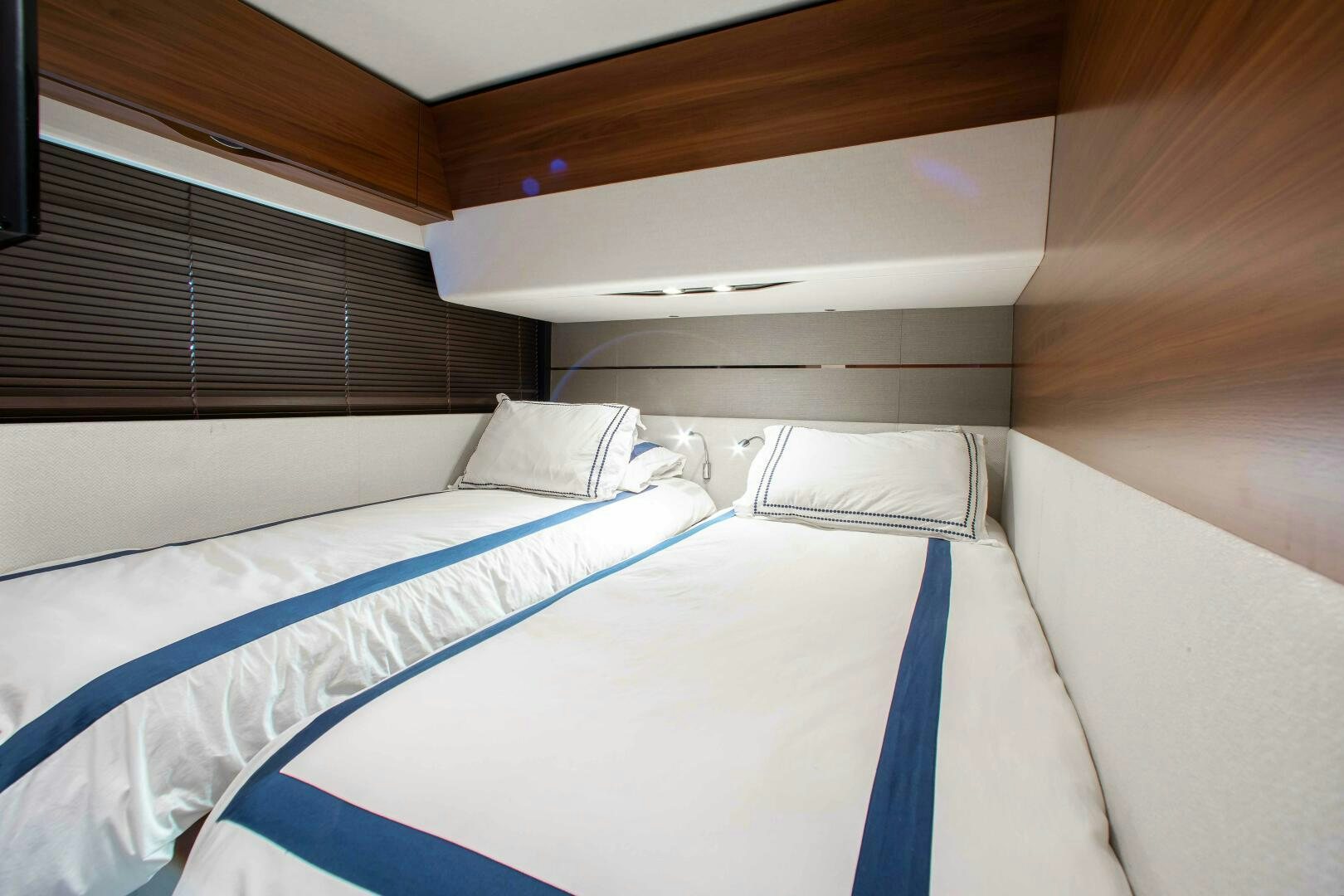 a couple of beds in a room aboard RIPPLE Yacht for Sale