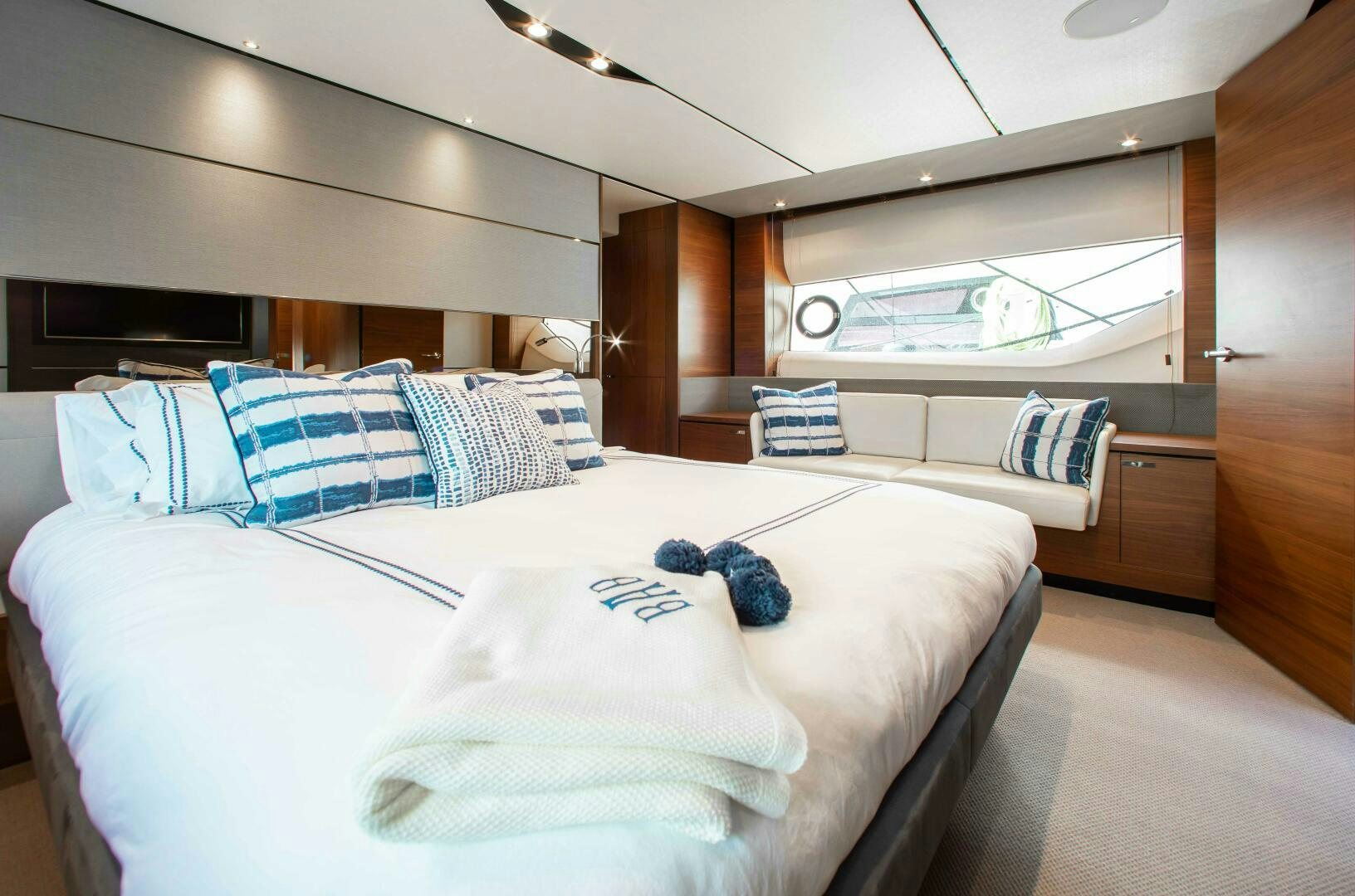 a room with beds and a window aboard RIPPLE Yacht for Sale