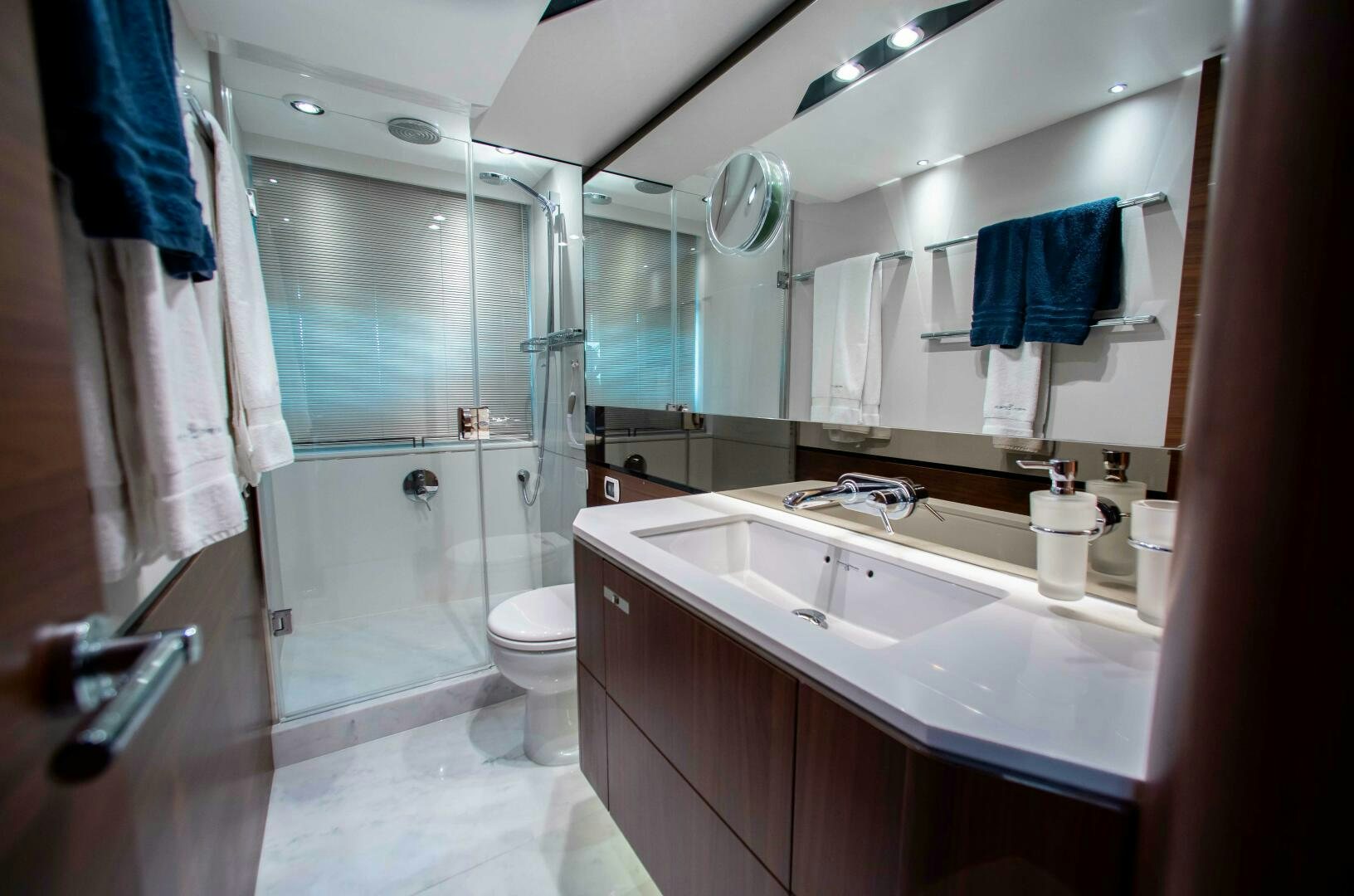 a bathroom with a glass shower aboard RIPPLE Yacht for Sale