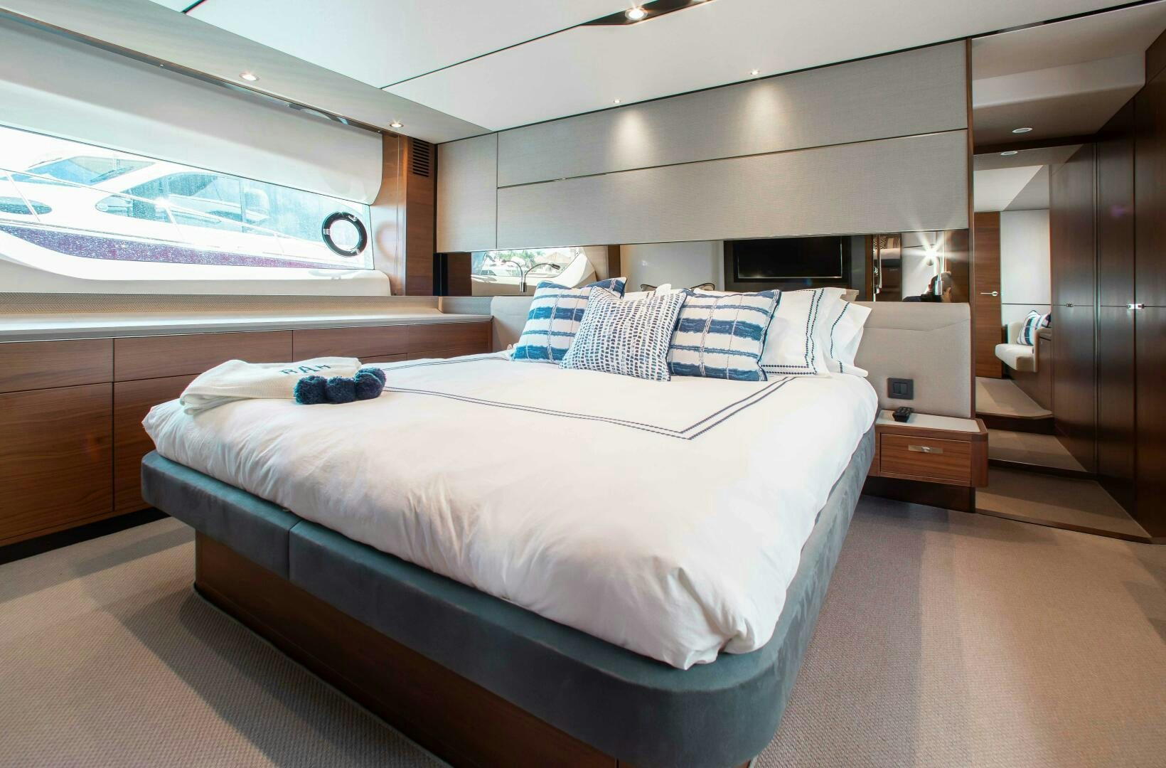 a room with a bed and a television aboard RIPPLE Yacht for Sale