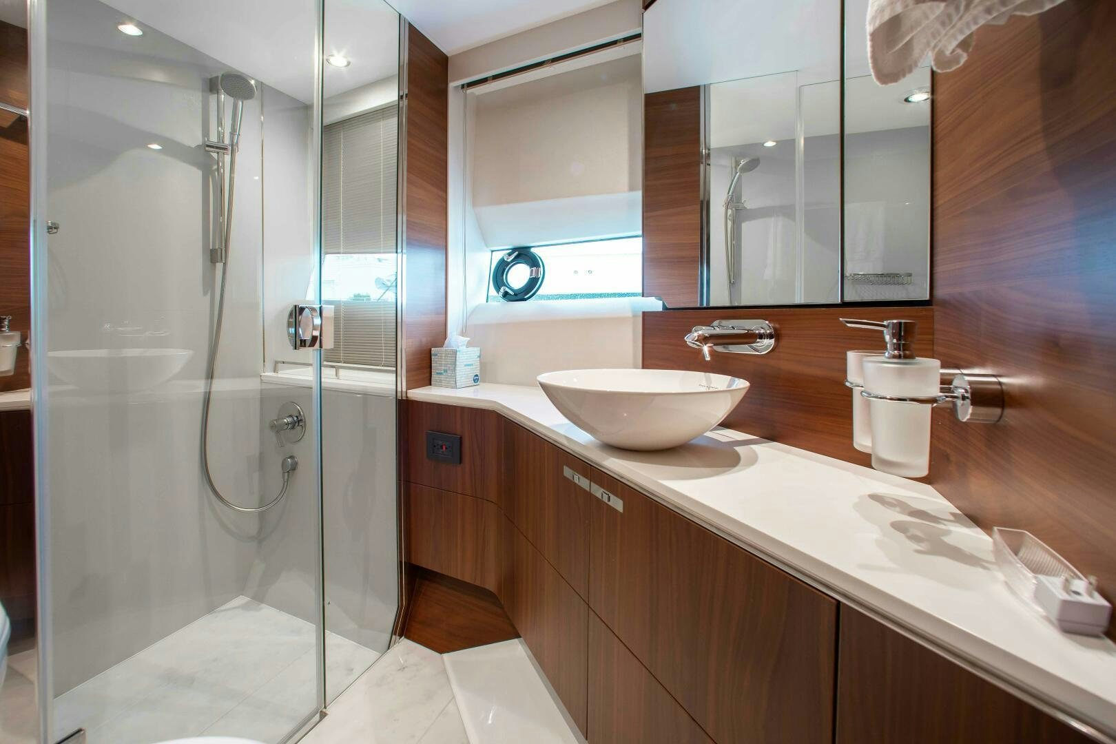 a bathroom with a glass shower aboard RIPPLE Yacht for Sale