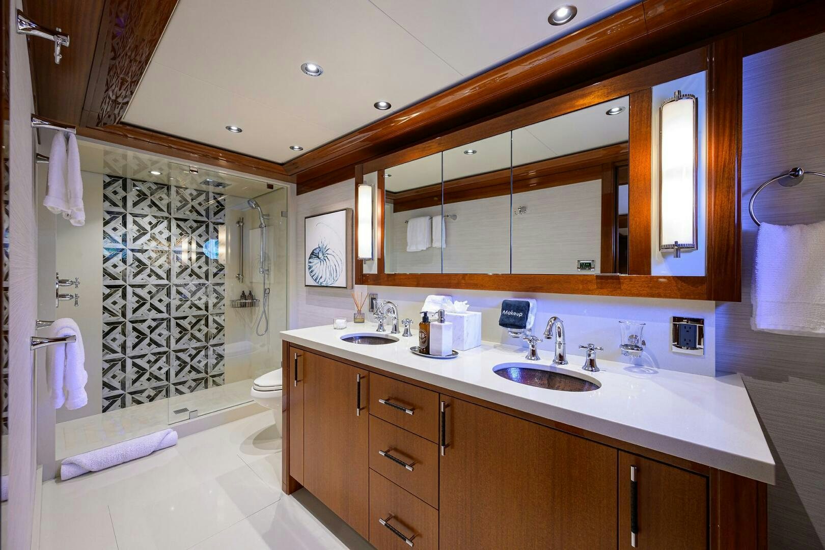 a bathroom with a large mirror aboard NEENAH Yacht for Sale