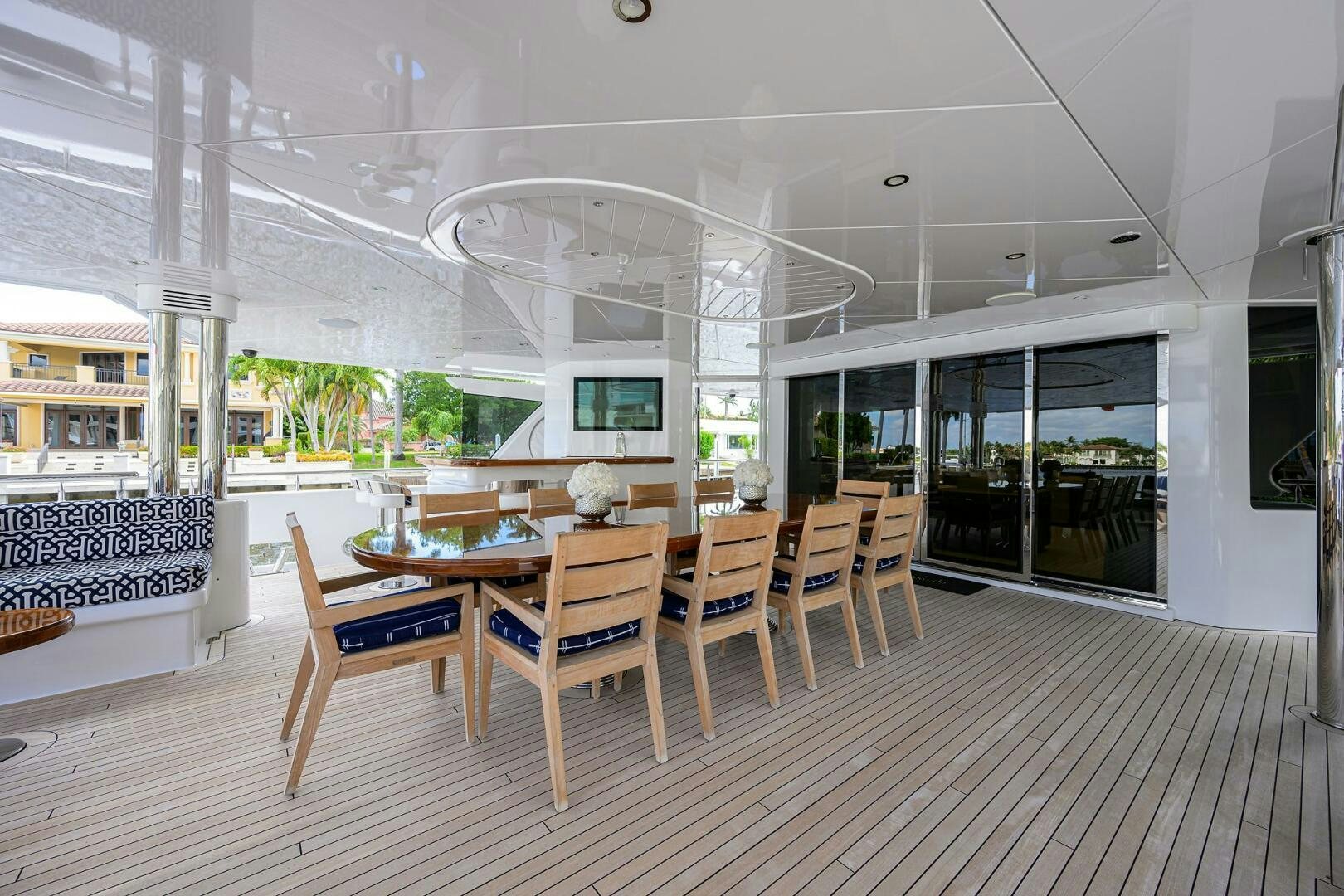 a room with tables and chairs aboard NEENAH Yacht for Sale
