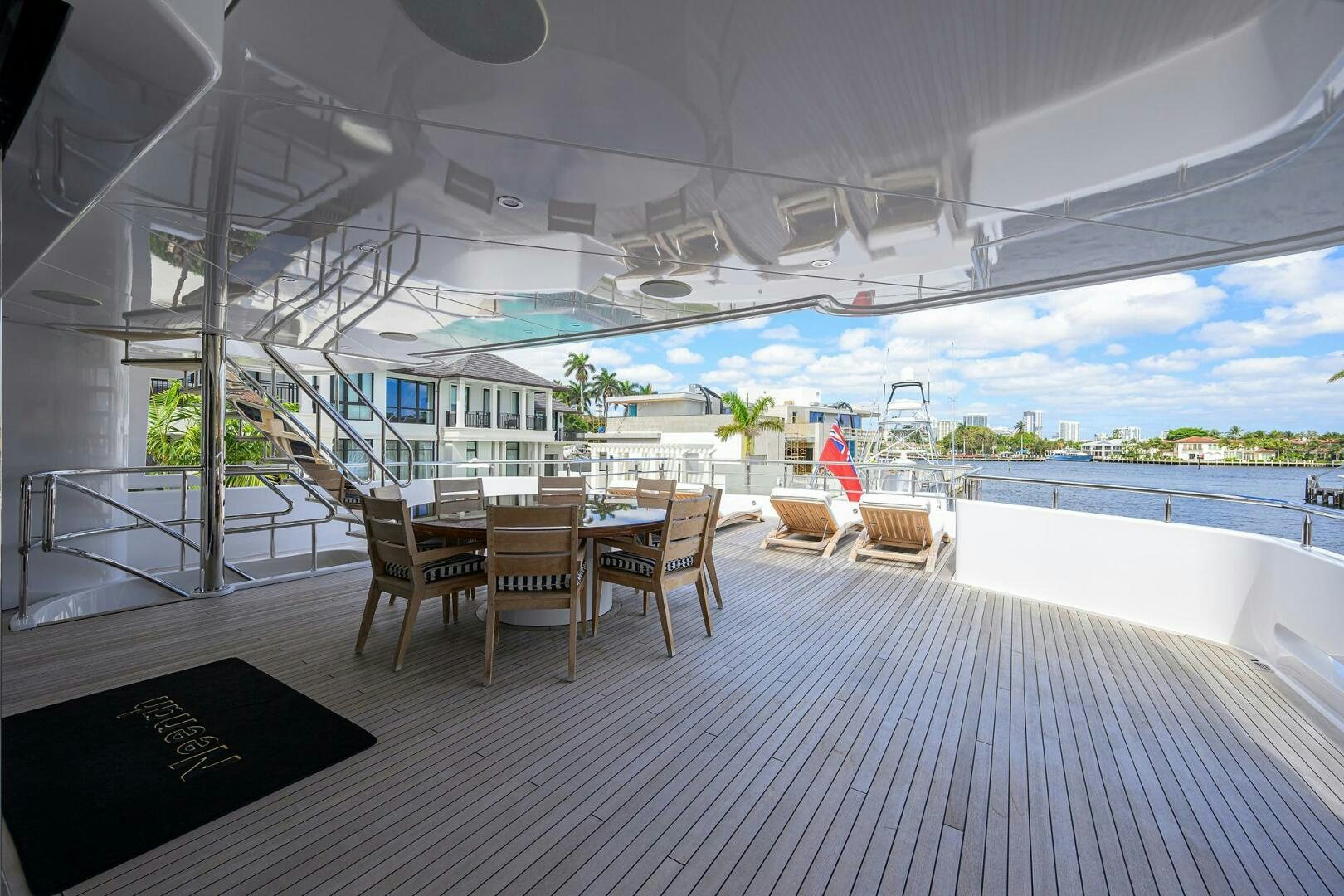 a room with a table and chairs aboard NEENAH Yacht for Sale