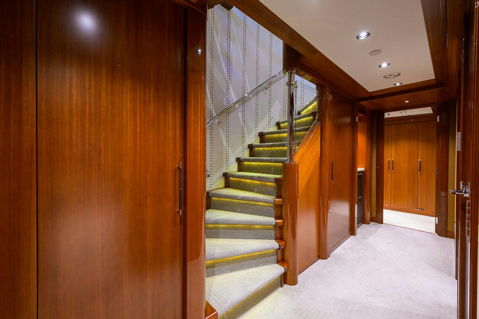a hallway with wooden doors aboard NEENAH Yacht for Sale
