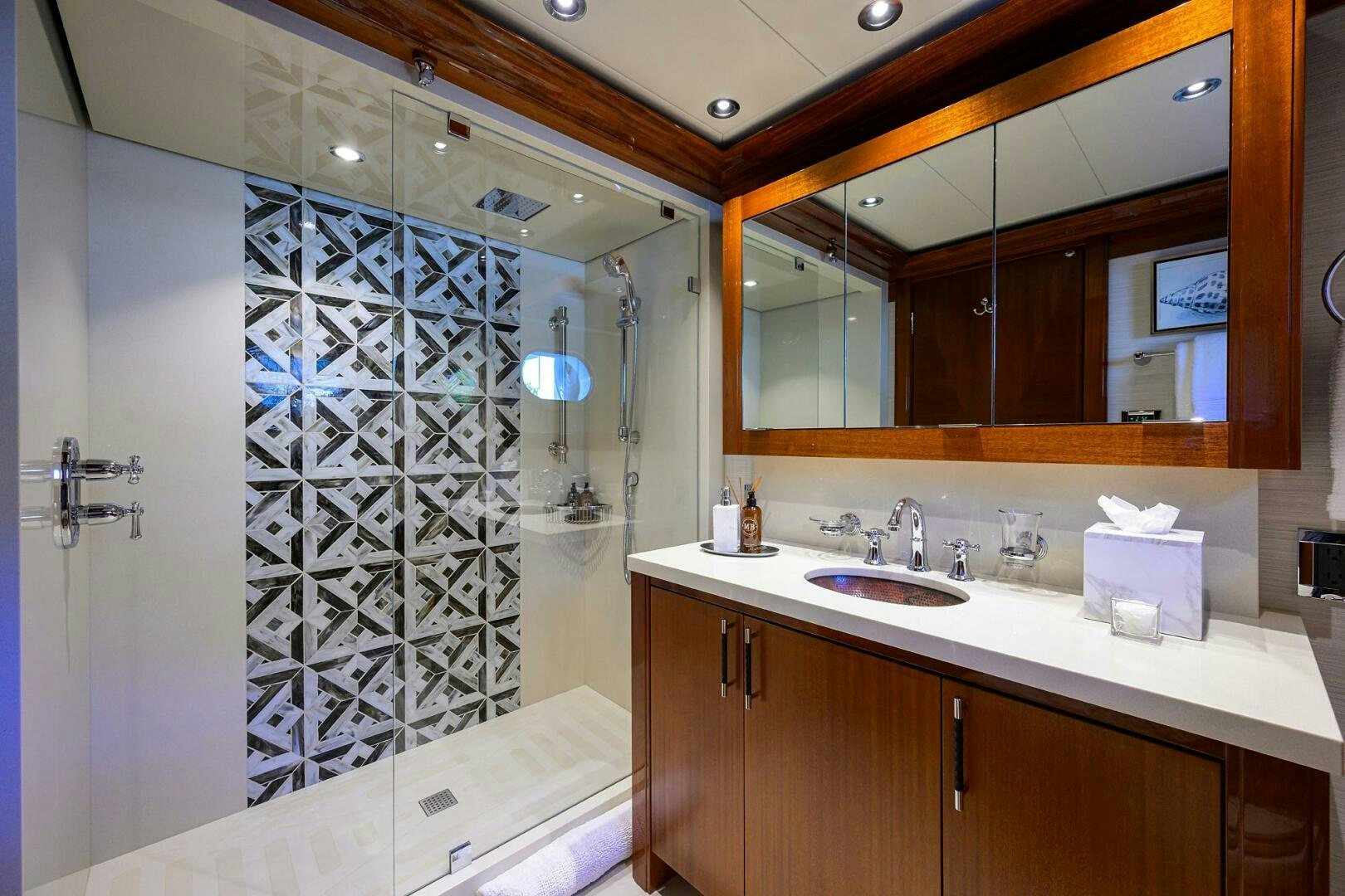 a bathroom with a shower and sink aboard NEENAH Yacht for Sale